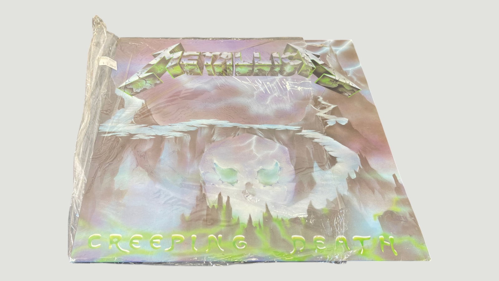 Metallica 'Creeping Death' 12" Vinyl Single (1984, Music for Nations): This is Metallica's iconic 'Creeping Death' 12-inch vinyl single, originally released in 1984 on Music for Nations (UK pressing). The single features the landmark track from the 'Ride the Lightning' e