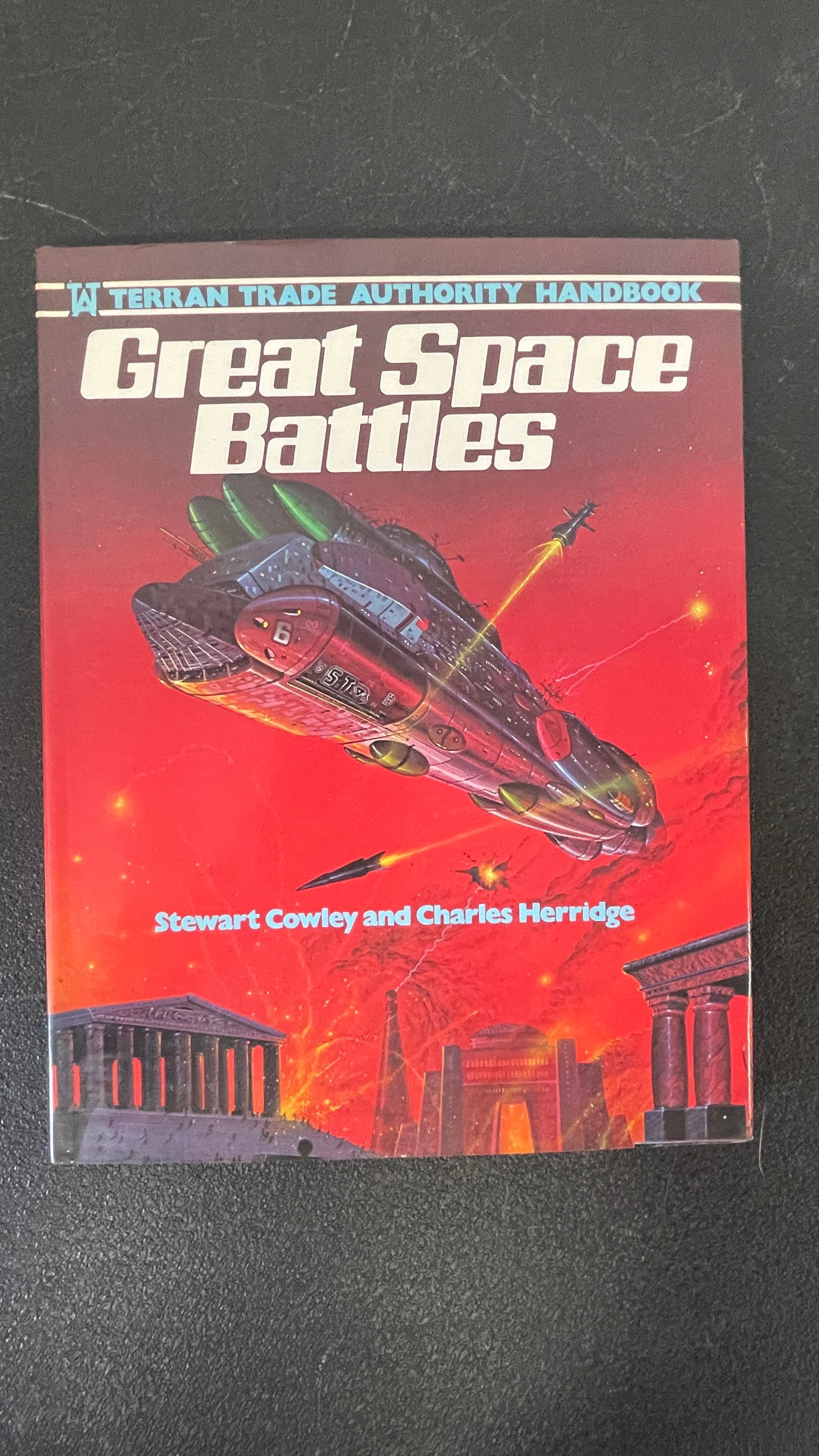 Great Space Battles – Terran Trade Authority Handbook, Cowley & Herridge, 1979: A copy of 'Great Space Battles,' part of the acclaimed Terran Trade Authority Handbook series, written by Stewart Cowley and Charles Herridge and published by Hamlyn in 1979. The series is renowned fo
