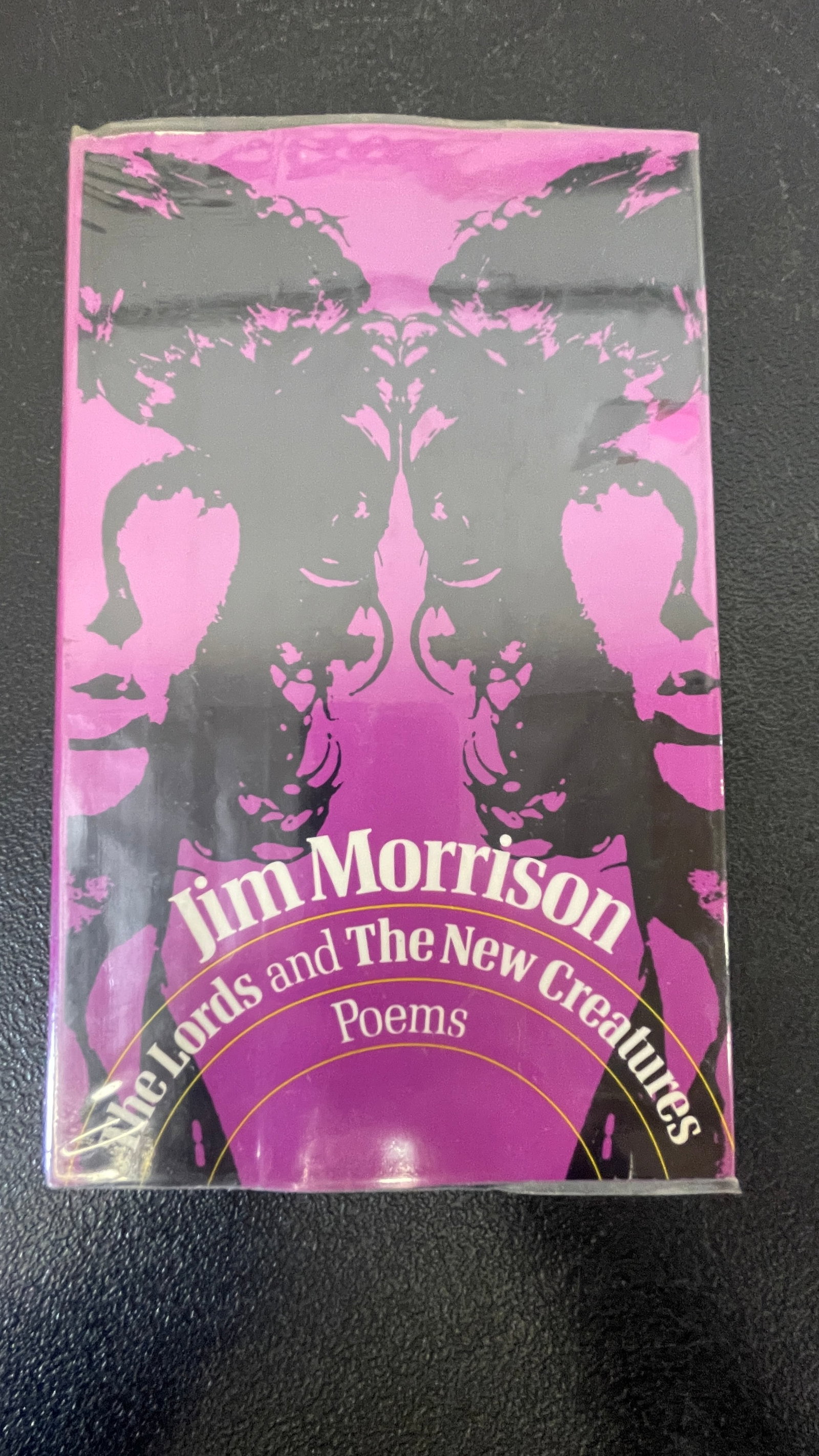 Jim Morrison 'The Lords and The New Creatures' Poems Hardcover First Edition: A hardcover edition of Jim Morrison's poetry collection 'The Lords and The New Creatures,' published by Simon & Schuster. This combined volume brings together Morrison's two self-published poetry