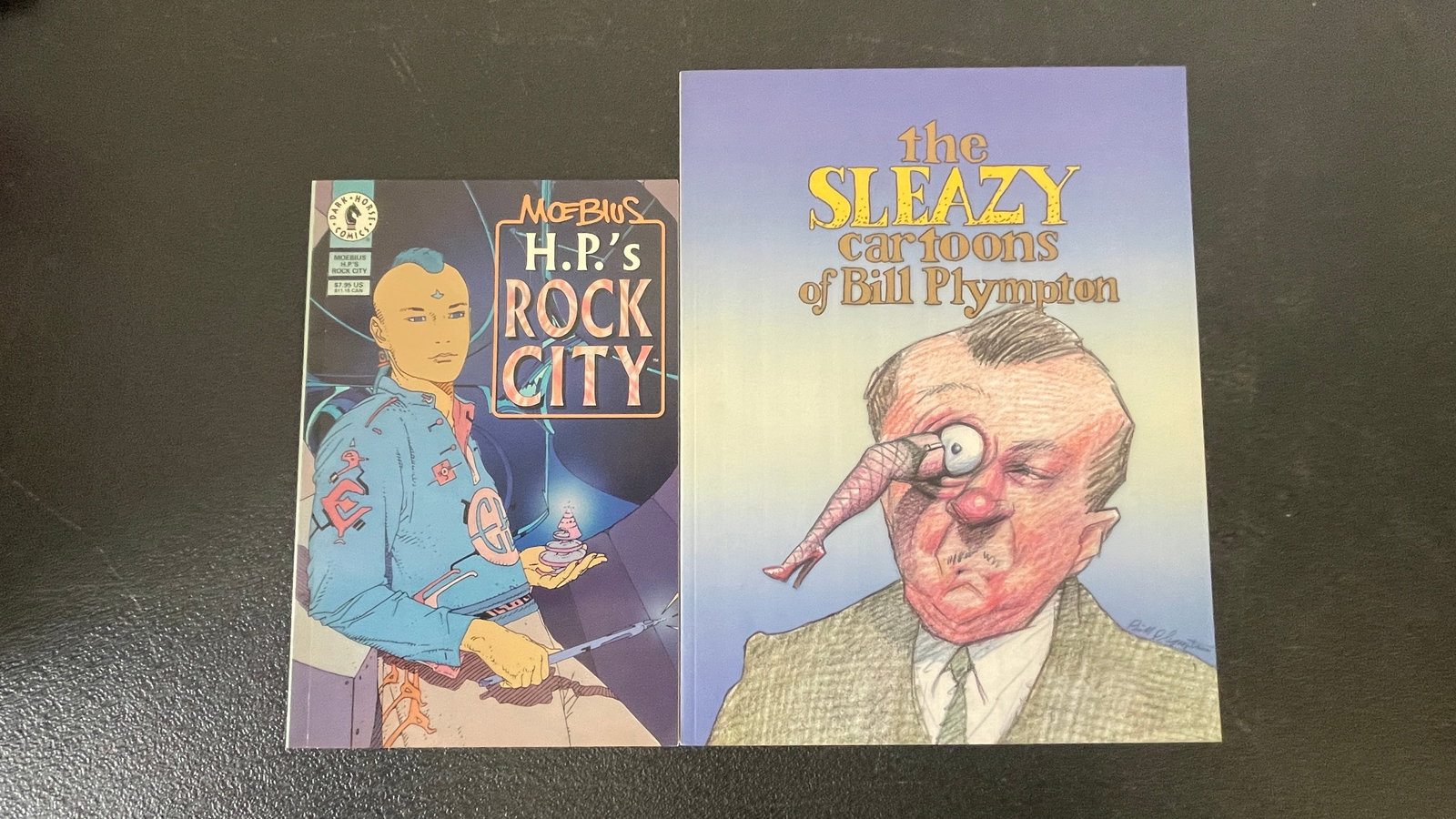 Moebius H.P.'s Rock City Dark Horse + The Sleazy Cartoons of Bill Plympton: A pairing of two notable alternative/underground graphic publications: 'Moebius: H.P.'s Rock City' published by Dark Horse Comics, a science-fiction graphic album by the legendary French artist Jean
