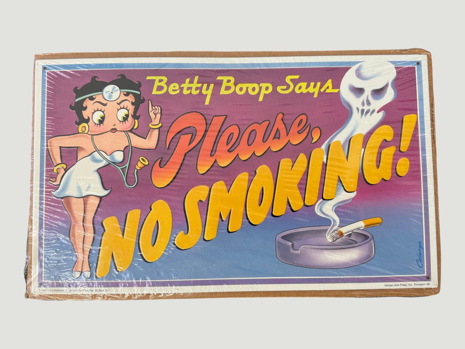 Betty Boop 'Please No Smoking' Tin Sign, Kitchen Sink Press, 1991: A vintage Betty Boop 'Please, No Smoking!' metal tin sign produced by Kitchen Sink Press, Inc. of Princeton, WI, copyright 1991, featuring the iconic animated character depicted as a nurse with stetho