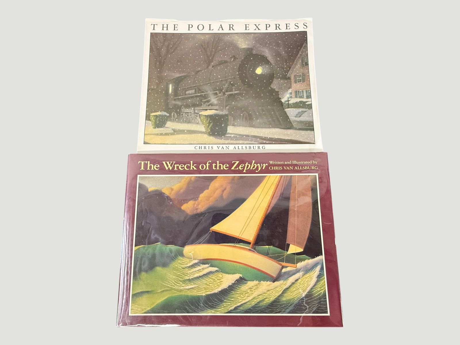 Chris Van Allsburg Children's Books: The Polar Express & The Wreck of the Zephyr: Two classic children's picture books by acclaimed author and illustrator Chris Van Allsburg, published by Houghton Mifflin. Includes 'The Polar Express' (1985), the Caldecott Medal-winning Christmas s