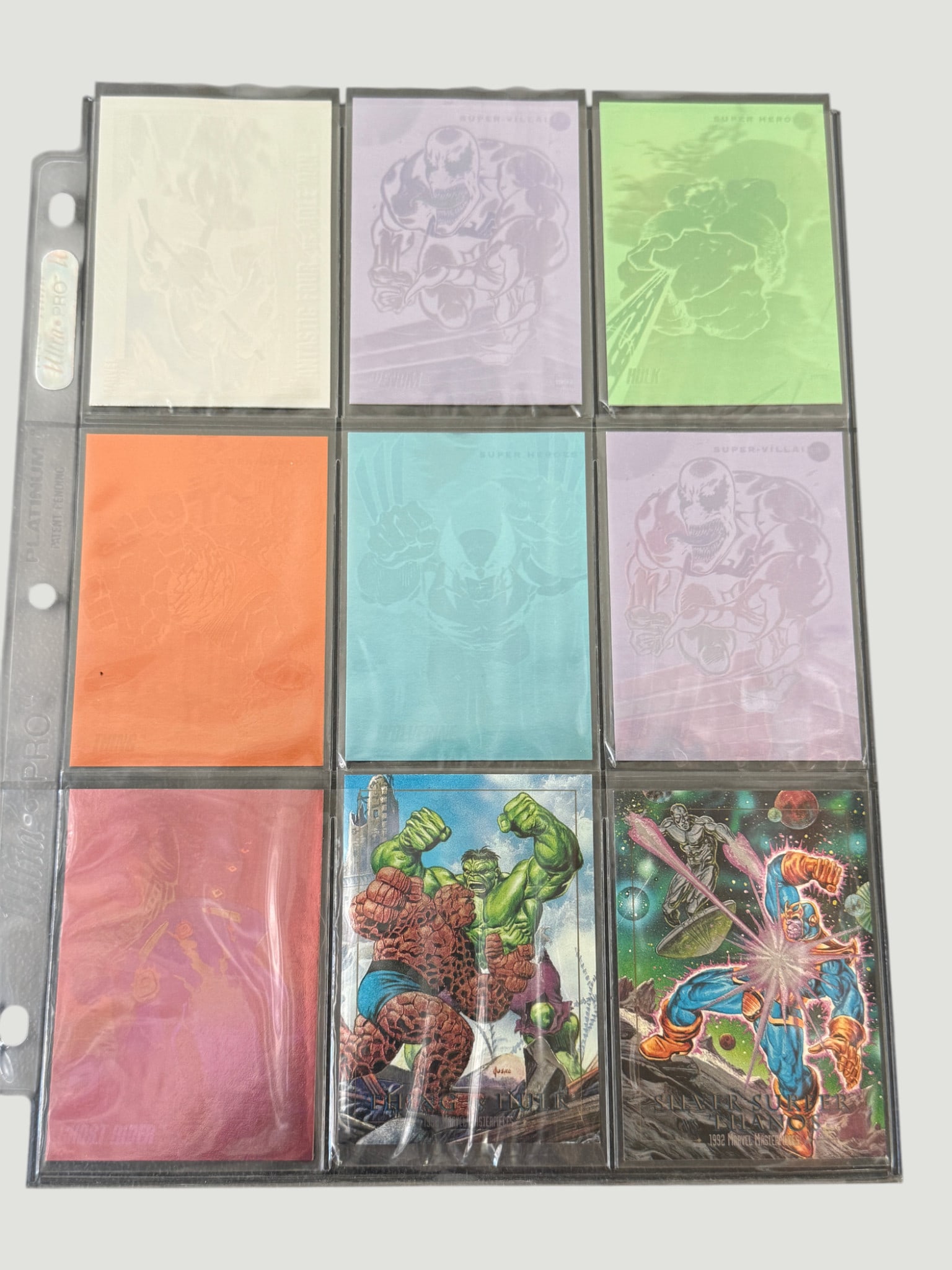 1992 Marvel Masterpieces Trading Cards – Printing Proofs & Holograms (9 Cards): A fascinating collection of nine cards from the 1992 Marvel Masterpieces set by SkyBox, including what appear to be rare color-separated printing proof cards in various single-color tints (white, purp