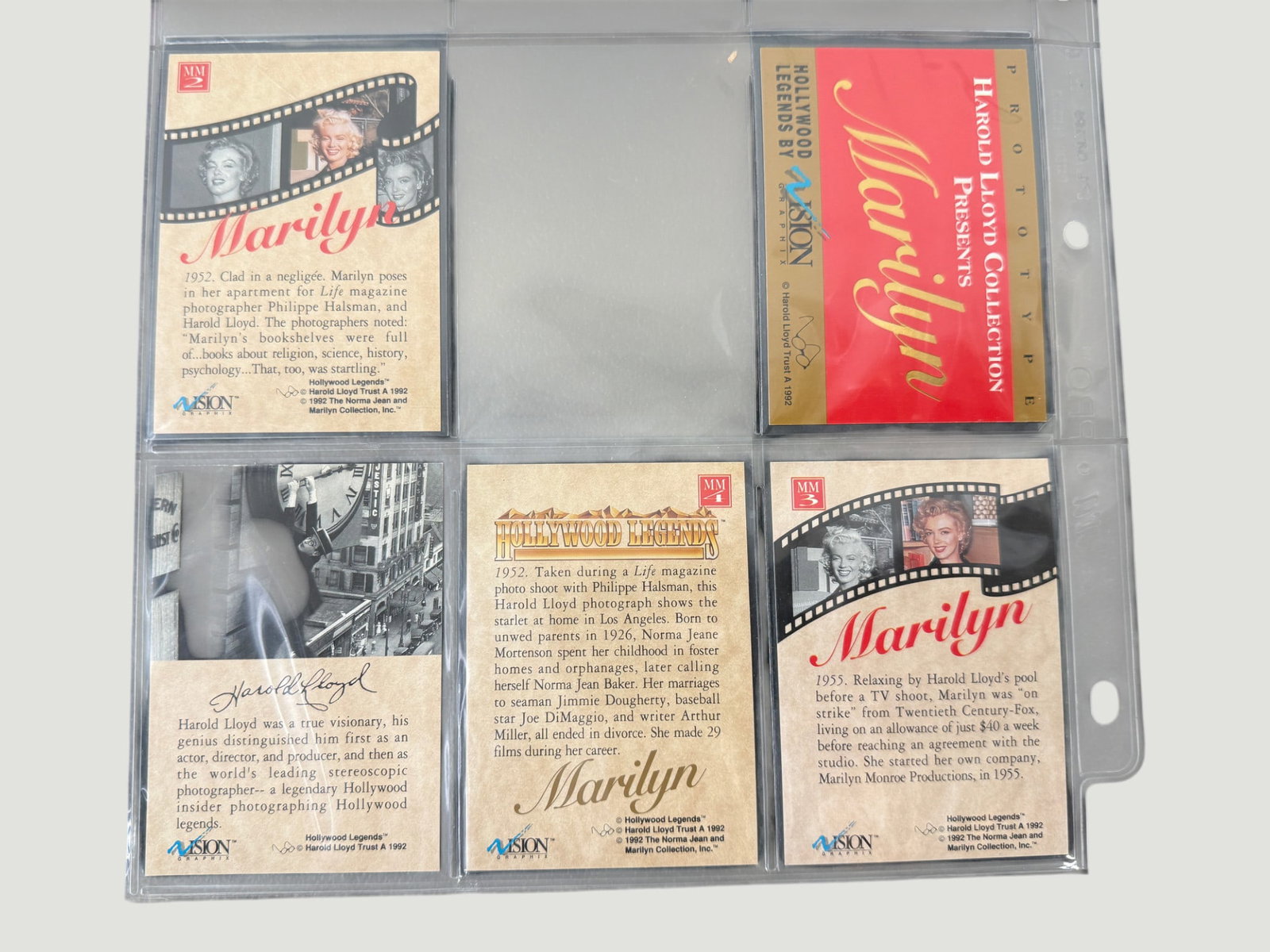 1992 Vision Graphics Hollywood Legends Marilyn Monroe Trading Cards Set inc Prototype: A set of 1992 Vision Graphics 'Hollywood Legends' trading cards featuring Marilyn Monroe, presented in a plastic collector's sleeve. The set includes cards MM2 and MM3 featuring photographs taken by H