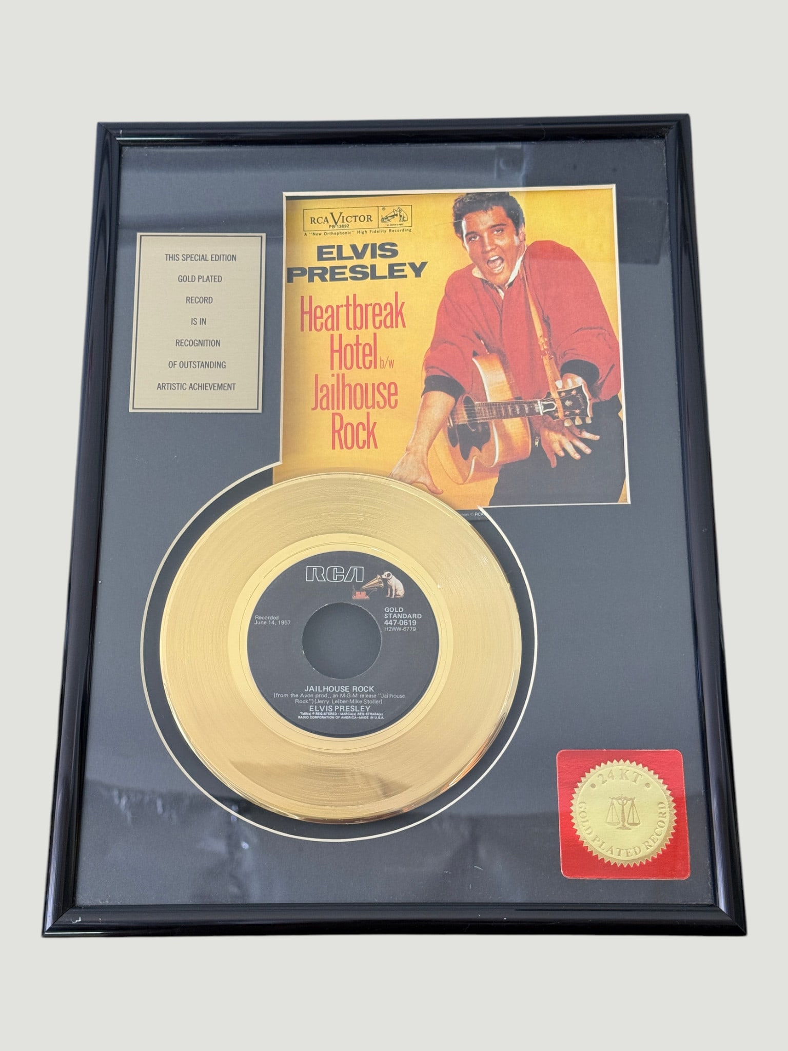 Elvis Presley 'Heartbreak Hotel/Jailhouse Rock' 24KT Gold Plated Record Display: A special edition 24-karat gold plated 7-inch single featuring Elvis Presley's iconic tracks 'Heartbreak Hotel' and 'Jailhouse Rock', released on RCA Victor label (catalogue number 447-0619). The reco