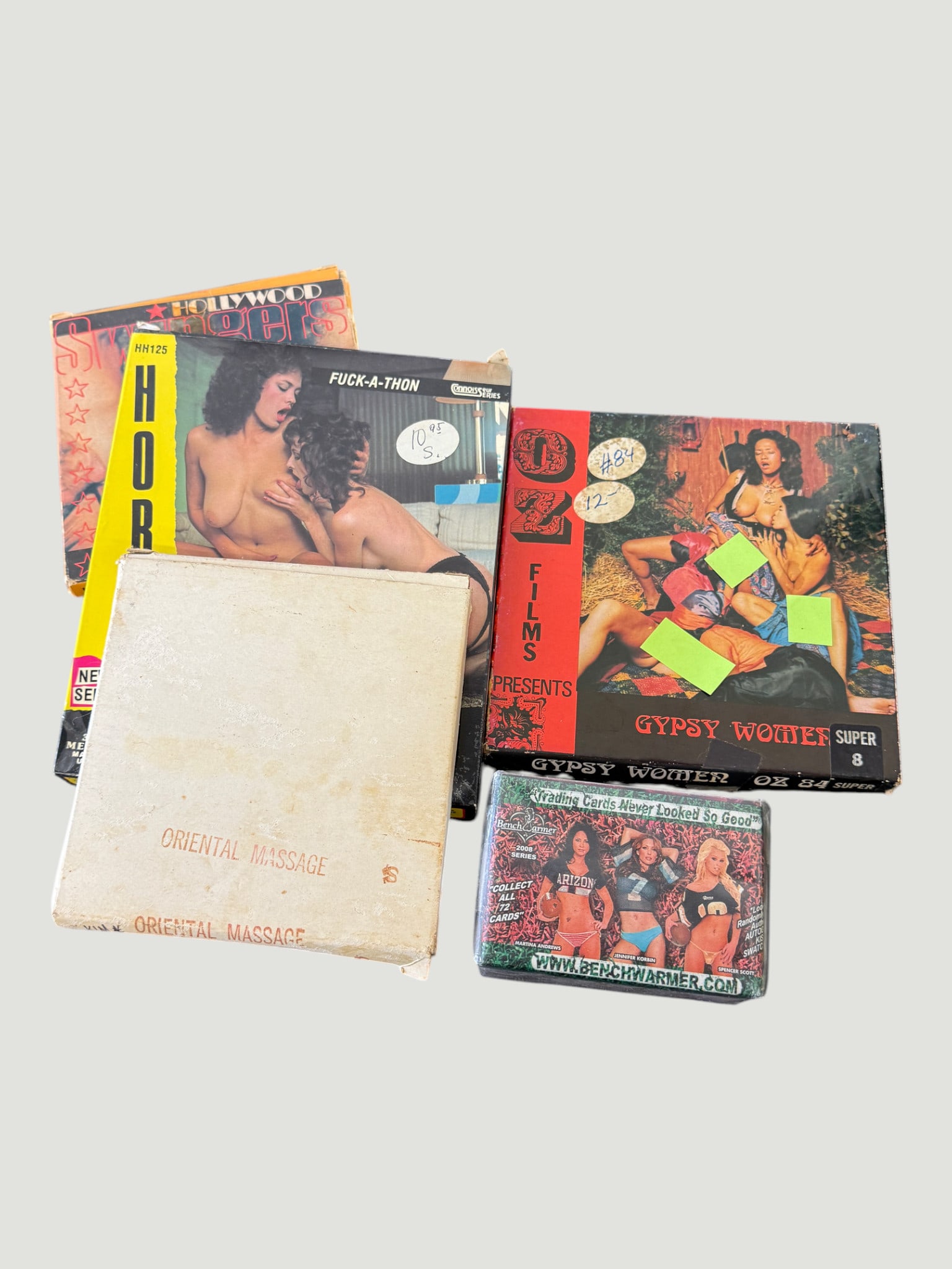 Vintage Adult Super 8mm Film & Collectibles Lot – 1970s/80s, 4 Items: A collection of vintage adult entertainment collectibles comprising four items: two Super 8mm film reels in original boxes including 'Gypsy Women' (OZ Films, Super 8) and 'Hollywood Hooters Fuck-A-Tho