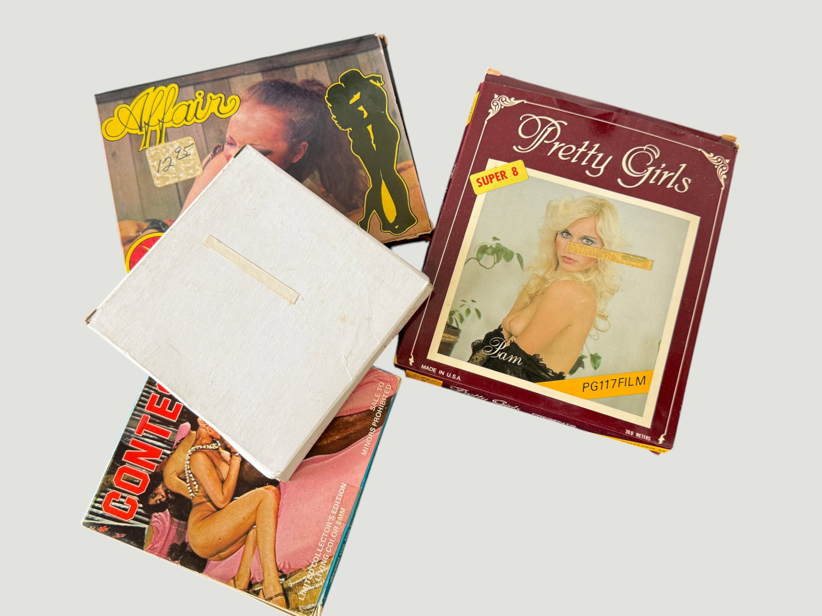 Vintage Adult Super 8mm Film & Collectibles Lot – 1970s/80s, 4 Items: A collection of vintage adult entertainment collectibles comprising four items: two Super 8mm film reels in original boxes including 'Gypsy Women' (OZ Films, Super 8) and 'Hollywood Hooters Fuck-A-Tho
