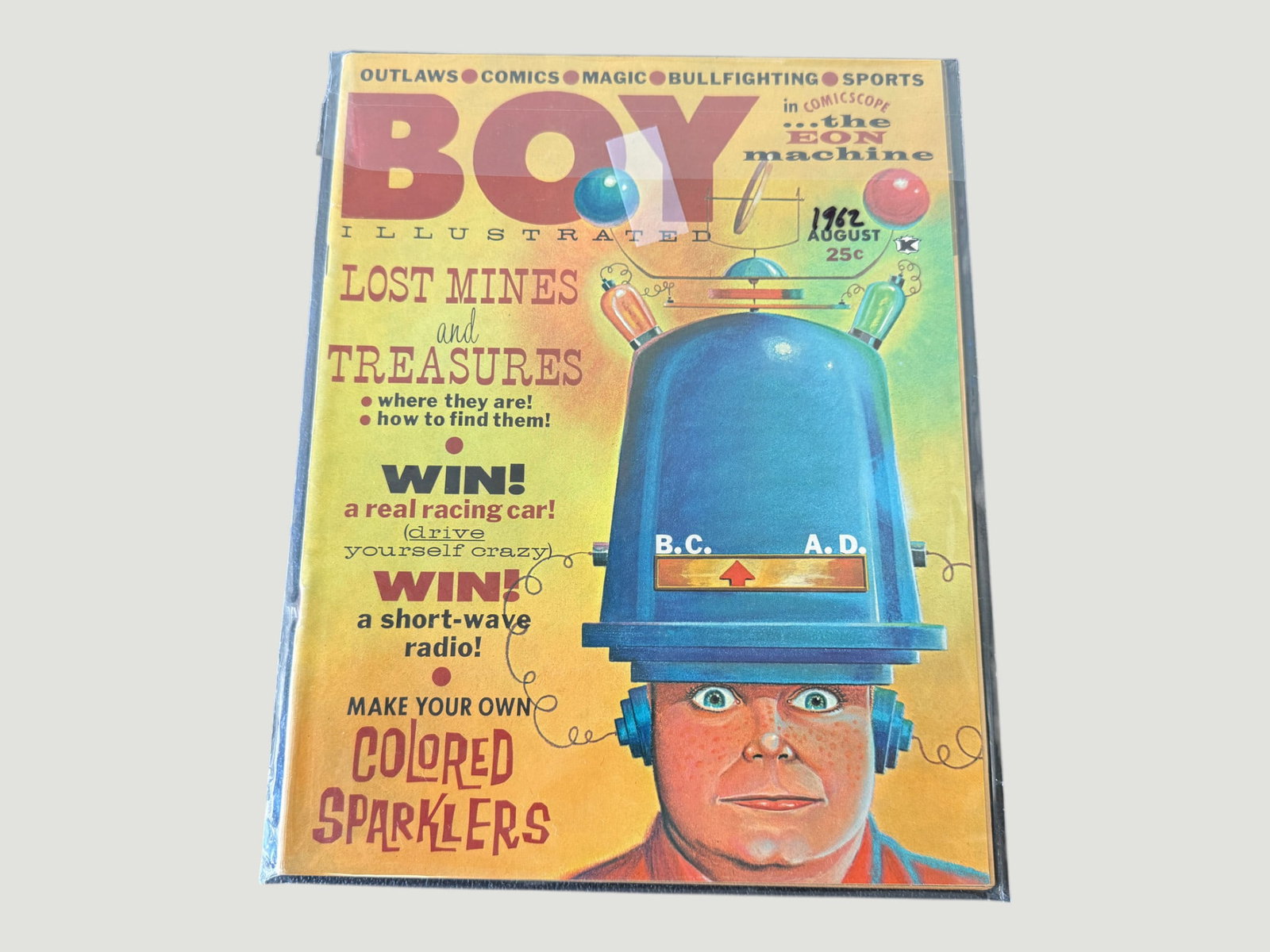 Boy Illustrated Magazine August 1962 — 'The Eon Machine' Comicscope Issue: A copy of 'Boy Illustrated' magazine dated August 1962, priced at 25 cents on the cover. The striking cover artwork features an illustrated boy wearing a futuristic 'Eon Machine' helmet device marked 