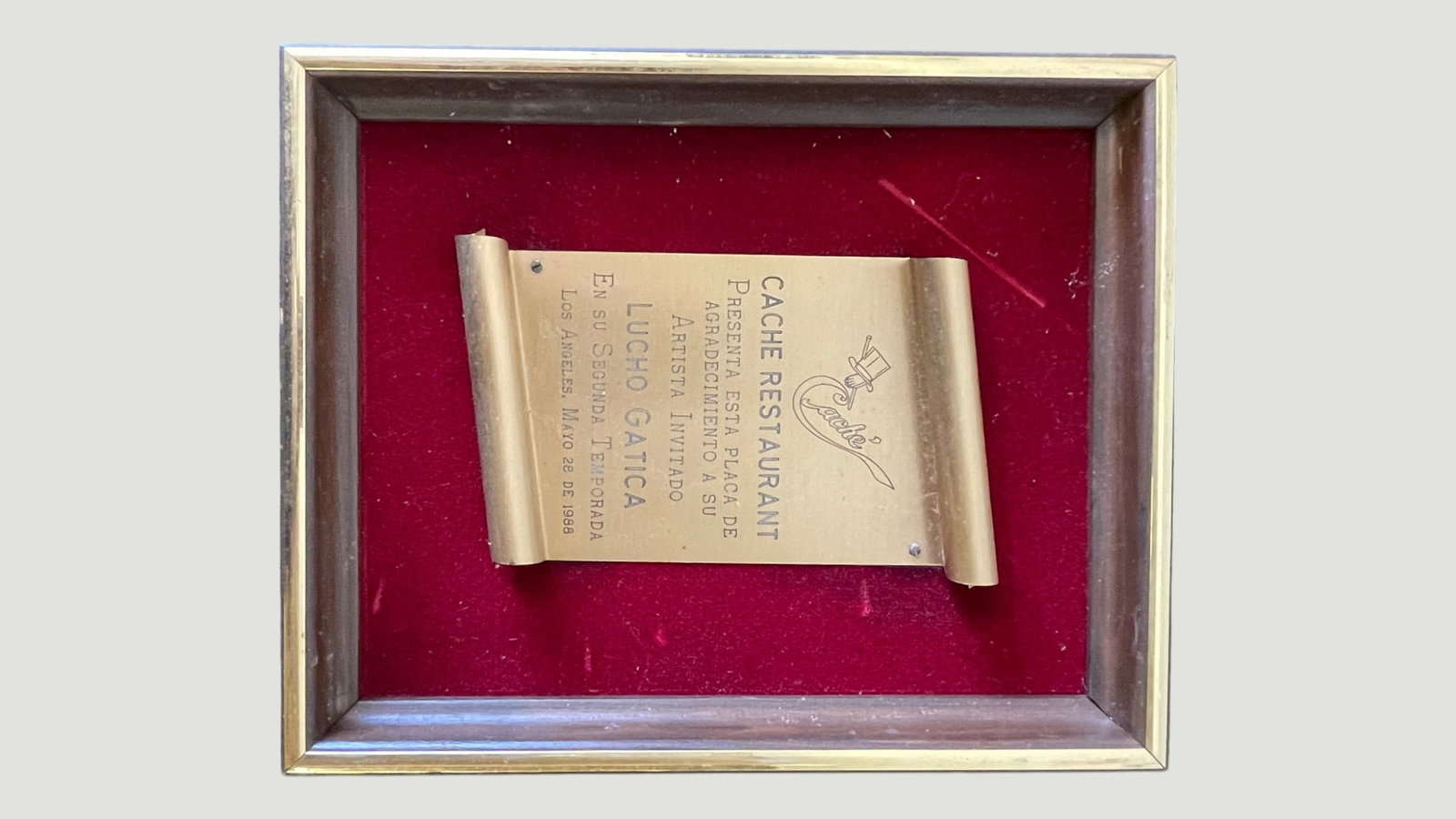 Lucho Gatica Cache Restaurant Los Angeles Recognition Plaque, May 1988: A framed brass scroll-style commemorative plaque presented by Cache Restaurant in Los Angeles to Chilean bolero legend Lucho Gatica on the occasion of his second season engagement, dated May 28, 1988.
