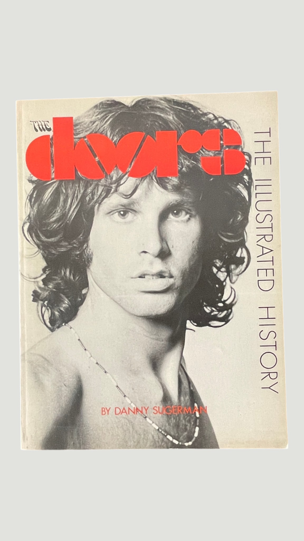 The Doors: The Illustrated History by Danny Sugerman Hardcover Book: A hardcover edition of 'The Doors: The Illustrated History' written by Danny Sugerman, one of the band's closest associates and co-author of the Jim Morrison biography 'No One Here Gets Out Alive.' Th