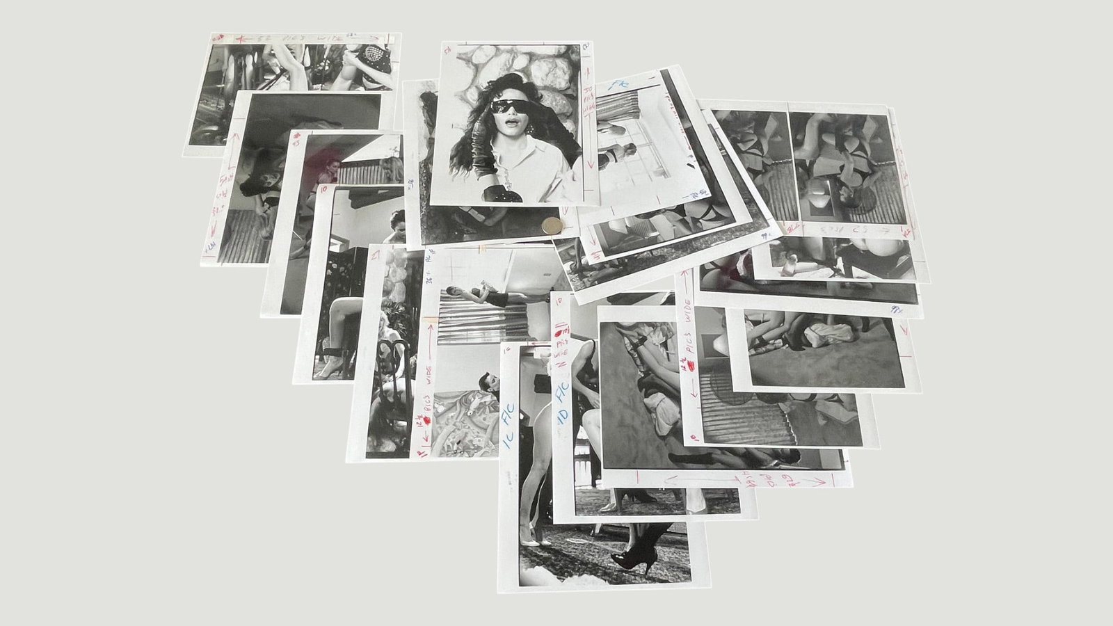 Vintage Black & White Photography Press Prints Collection with Crop Marks c.1980s: A collection of approximately 20-25 vintage black and white photographic prints, appearing to be professional press or editorial photographs from circa the 1980s, featuring fashion and glamour subject