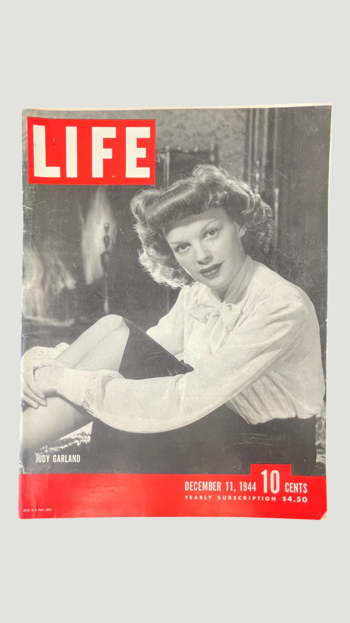 LIFE Magazine December 11, 1944 — Judy Garland Cover Issue: A vintage issue of LIFE Magazine dated December 11, 1944, featuring iconic American actress and entertainer Judy Garland on the cover in a striking black-and-white portrait photograph. Published durin