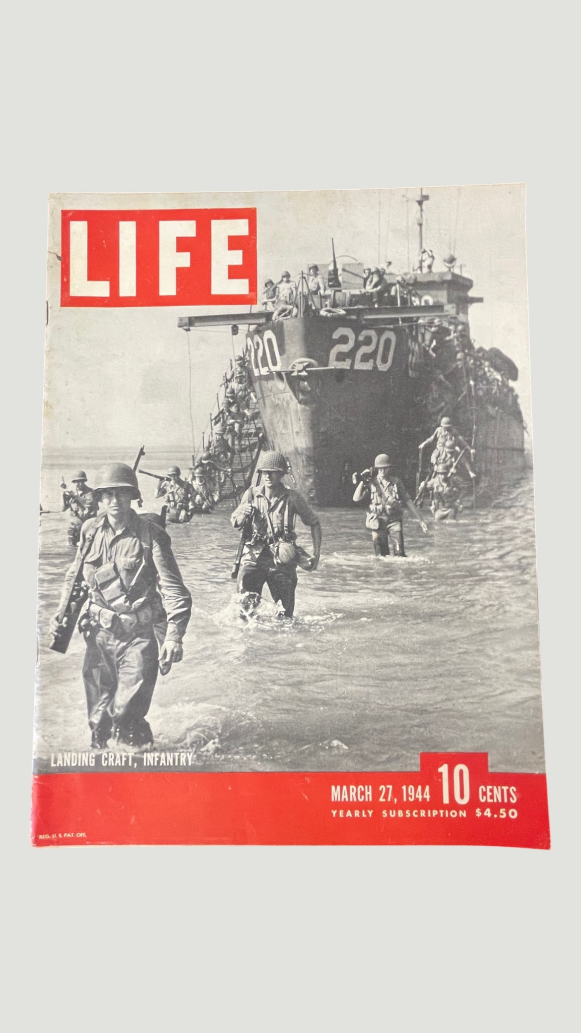 LIFE Magazine March 27, 1944 — WWII Landing Craft Infantry Cover: An original issue of LIFE Magazine dated March 27, 1944, featuring a striking black-and-white photographic cover captioned 'Landing Craft, Infantry,' depicting U.S. soldiers wading ashore from Landing