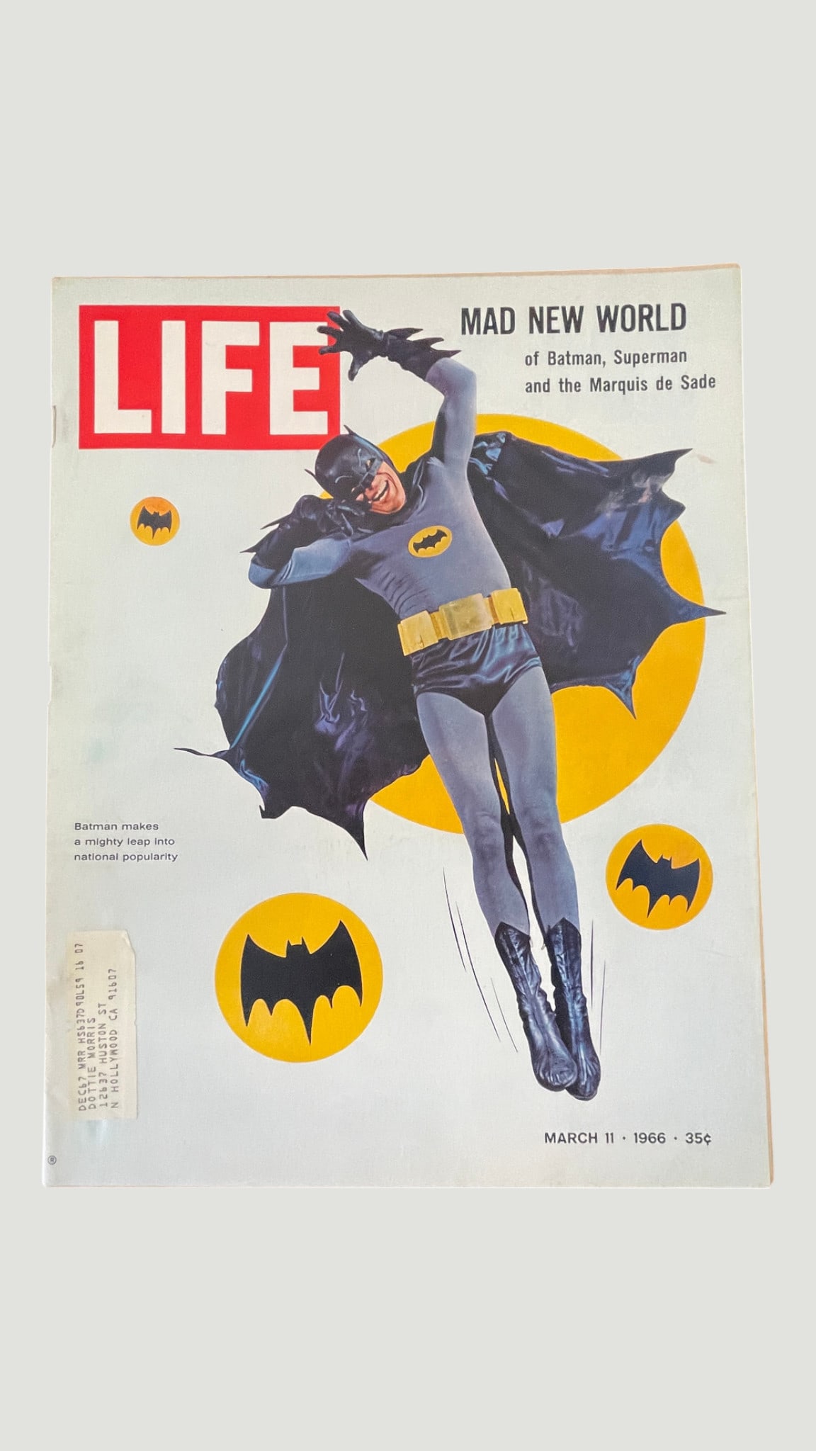 LIFE Magazine March 11, 1966 — Batman 'Mad New World' Cover Issue: A March 11, 1966 issue of LIFE Magazine featuring a striking full-cover image of Batman in costume, coinciding with the massive popularity of the ABC Batman television series starring Adam West. The h