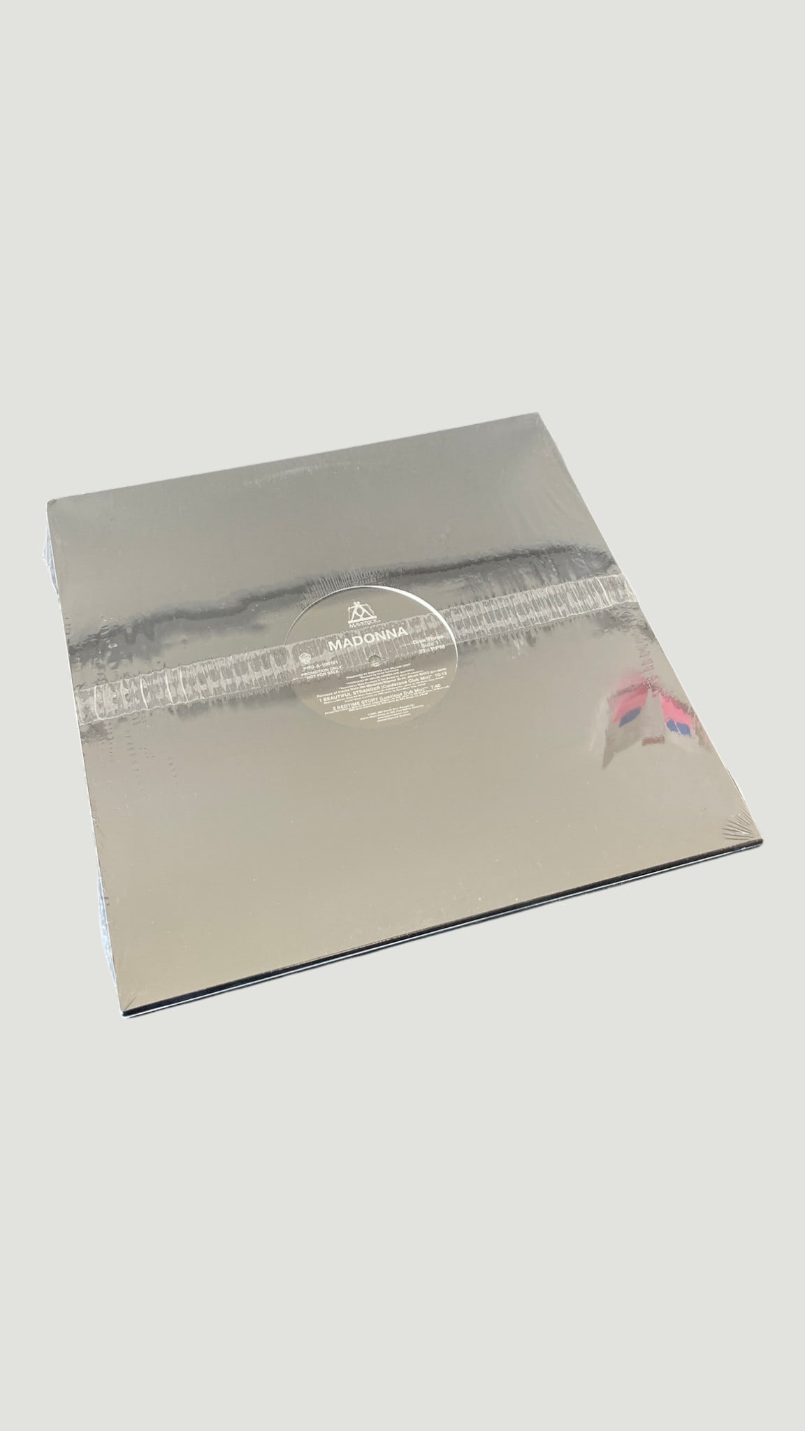 Madonna 12" Vinyl Single - Beautiful Stranger / Stereo MC's Mix, Maverick Records: A 12-inch vinyl single by Madonna released on Maverick Records, featuring 'Beautiful Stranger' along with remix variations including the Stereo MC's Mix. The cover features a distinctive silver/metall