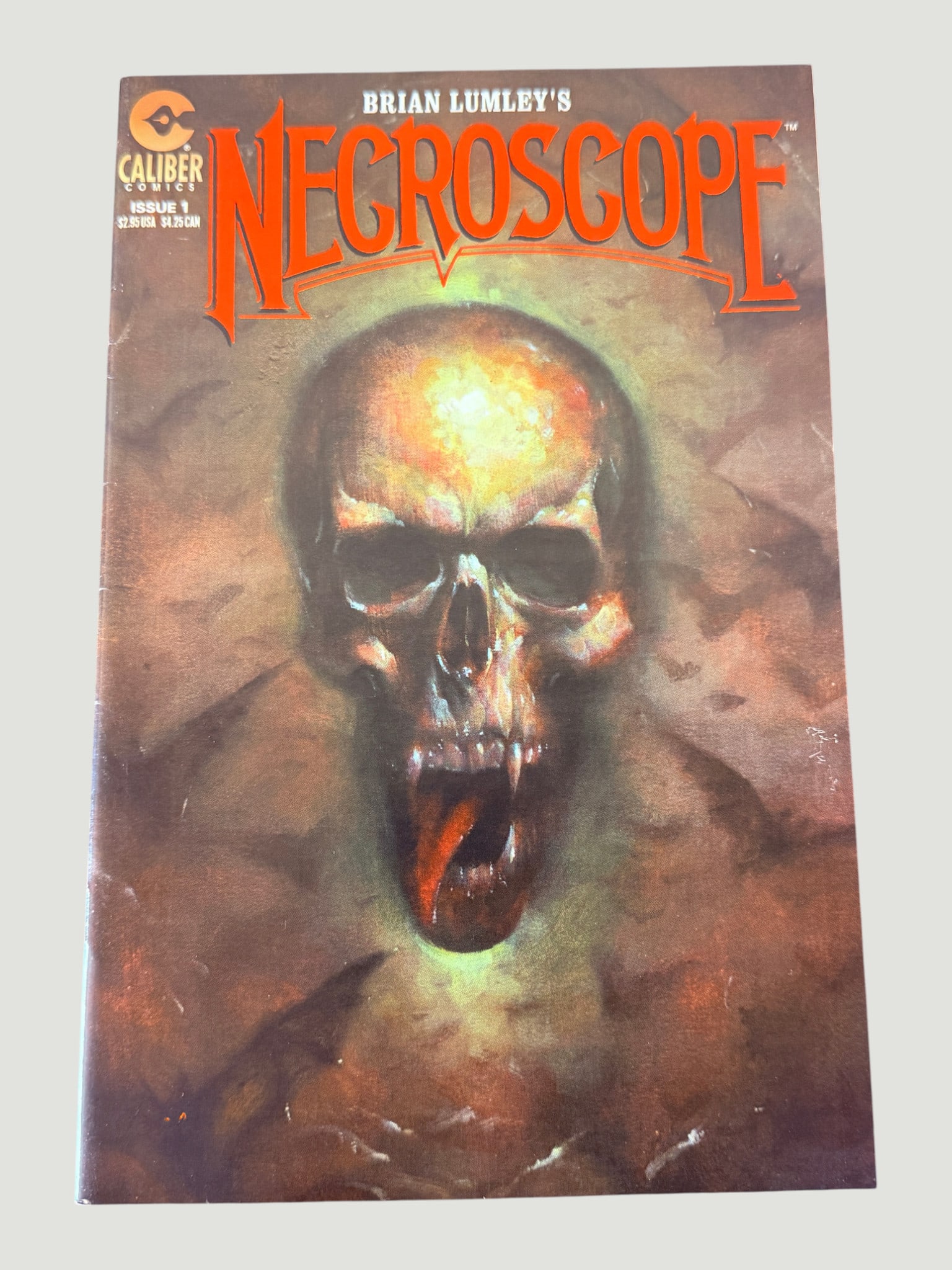 Brian Lumley's Necroscope #1, Caliber Comics, Horror Comic Book: Brian Lumley's Necroscope Issue #1, published by Caliber Comics, adapted from Brian Lumley's acclaimed British horror novel series of the same name. The cover features a striking painted artwork depic