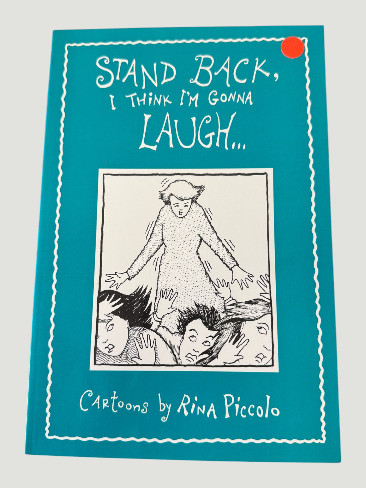 Stand Back, I Think I'm Gonna Laugh... Cartoons by Rina Piccolo Paperback: A cartoon collection book titled 'Stand Back, I Think I'm Gonna Laugh...' featuring cartoons by Rina Piccolo, published as a teal/turquoise paperback volume. Rina Piccolo is a Canadian cartoonist know