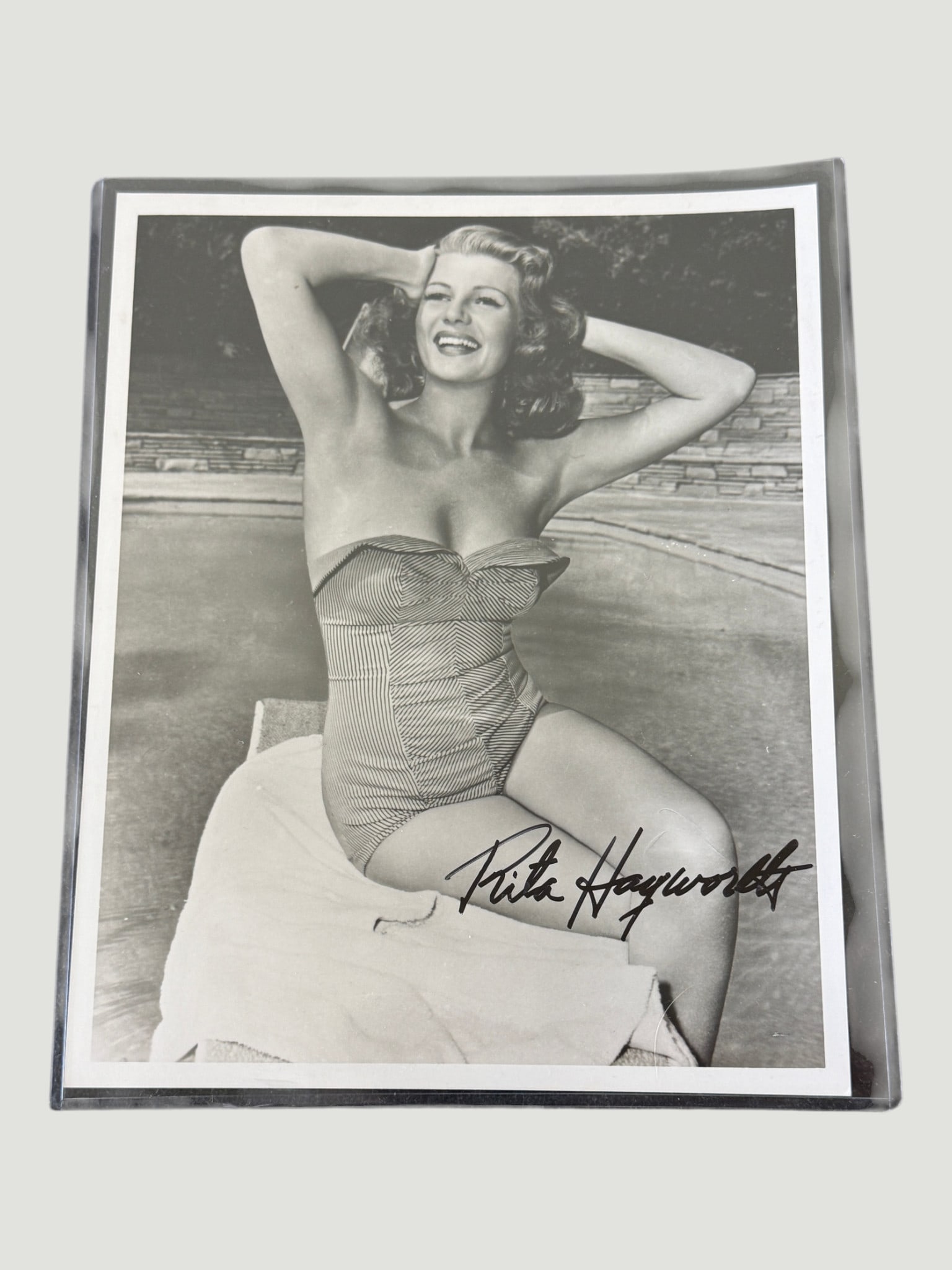 Rita Hayworth Signed 8x10 B&W Glamour Photo Autograph — Hollywood Golden Age: A classic black and white 8x10 inch promotional/glamour photograph of Rita Hayworth (1918–1987), the iconic Hollywood actress and dancer known as the 'Love Goddess' of the Golden Age of cinema. The 