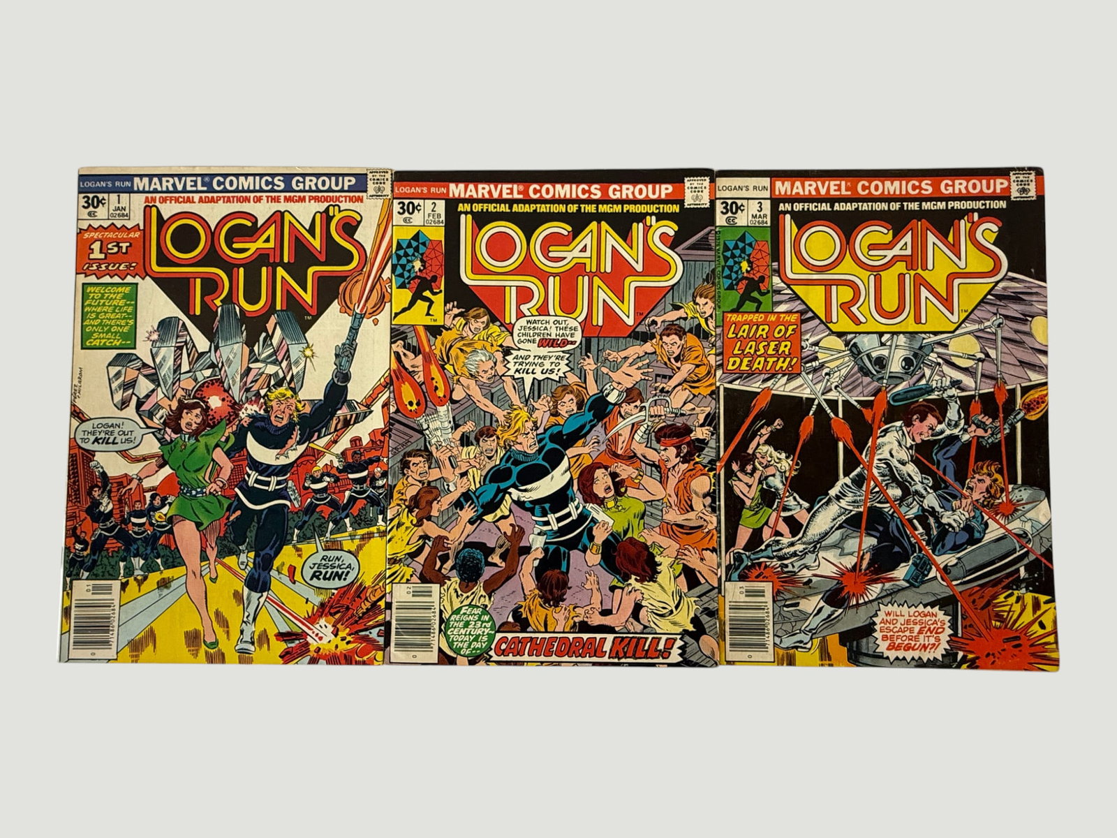 Logan's Run #1-3 Marvel Comics Group 1977 MGM Adaptation Complete Set: A complete run of the first three issues of Marvel Comics Group's official adaptation of the MGM science-fiction film 'Logan's Run,' published January through March 1977 and priced at 30 cents each. T