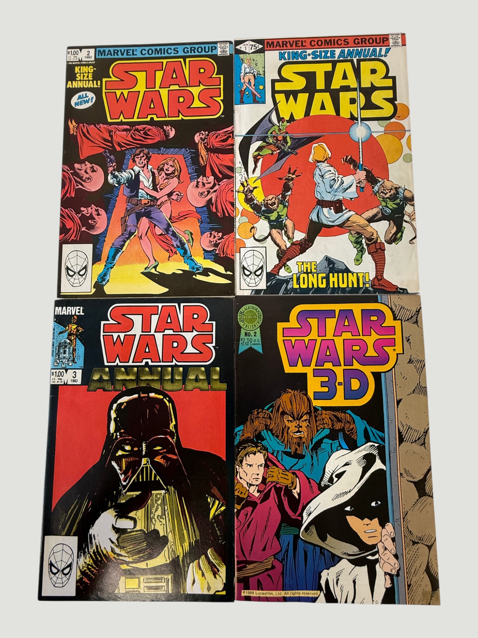 Star Wars Marvel Comics Lot: Annuals #1 & #2, Annual #3, 3-D #2 (1977–1987): A collection of four Marvel Comics Star Wars special editions, comprising King-Size Annual #1 ('The Long Hunt'), King-Size Annual #2, Star Wars Annual #3 featuring Darth Vader, and Star Wars 3-D #2 pu