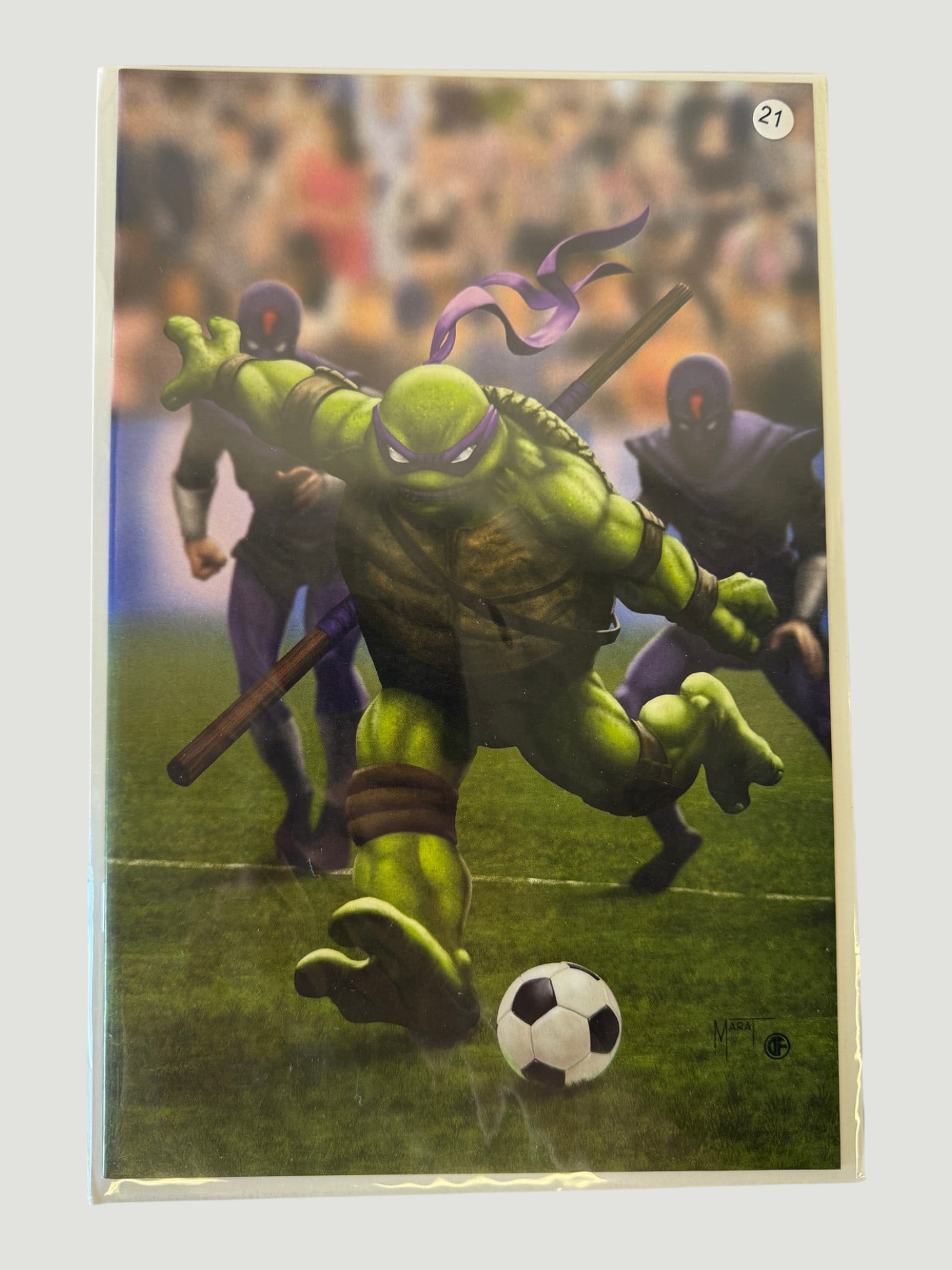 TMNT Donatello Soccer Variant Comic Art Print #21 Bagged: A vibrant variant cover art print featuring Donatello from Teenage Mutant Ninja Turtles, depicted in a dynamic soccer kick pose on a football pitch, with a soccer ball mid-flight. The artwork showcase
