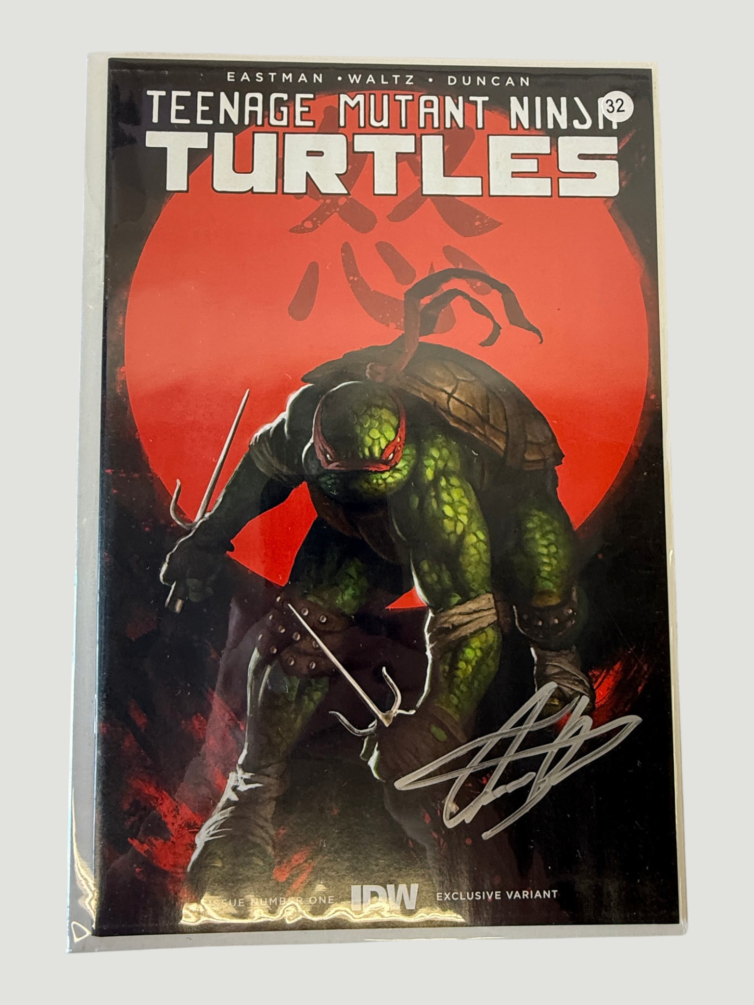 TMNT Teenage Mutant Ninja Turtles #32 IDW Exclusive Variant Signed Comic: Teenage Mutant Ninja Turtles #32 published by IDW Publishing, featuring a striking painted-style cover art depicting Raphael against a blood-red moon backdrop, by creators Eastman, Waltz, and Duncan. 
