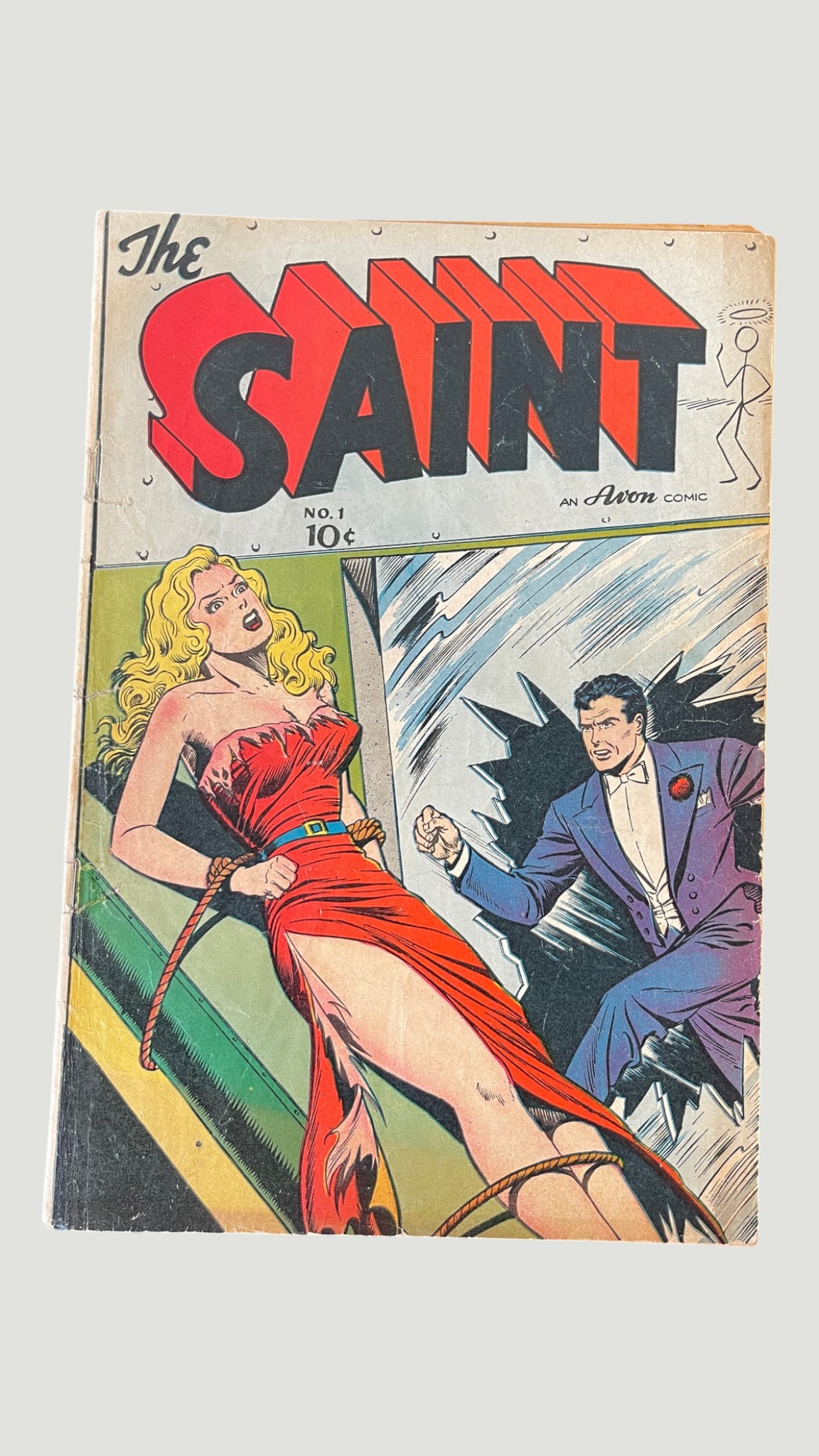 The Saint #1 Avon Comics 1947 — Classic Golden Age Crime Comic First Issue: The Saint #1, published by Avon Comics in 1947, is the debut issue of the comic book adaptation of Leslie Charteris's iconic fictional hero Simon Templar, known as 'The Saint.' The cover features a dr