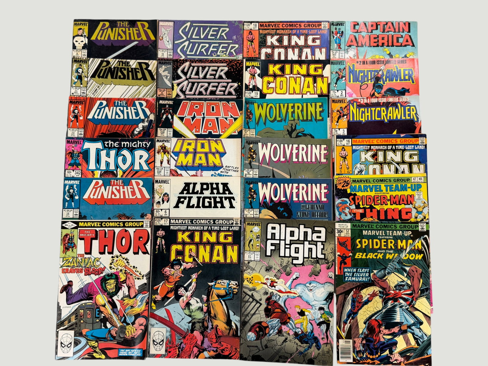 Marvel Comics Collection x20: Punisher, Wolverine, Thor, Spider-Man & More 1970s-80s: A collection of approximately 20 Marvel Comics issues spanning the late 1970s to mid-1980s, featuring titles including The Punisher, Silver Surfer, King Conan, Captain America, Nightcrawler, Iron