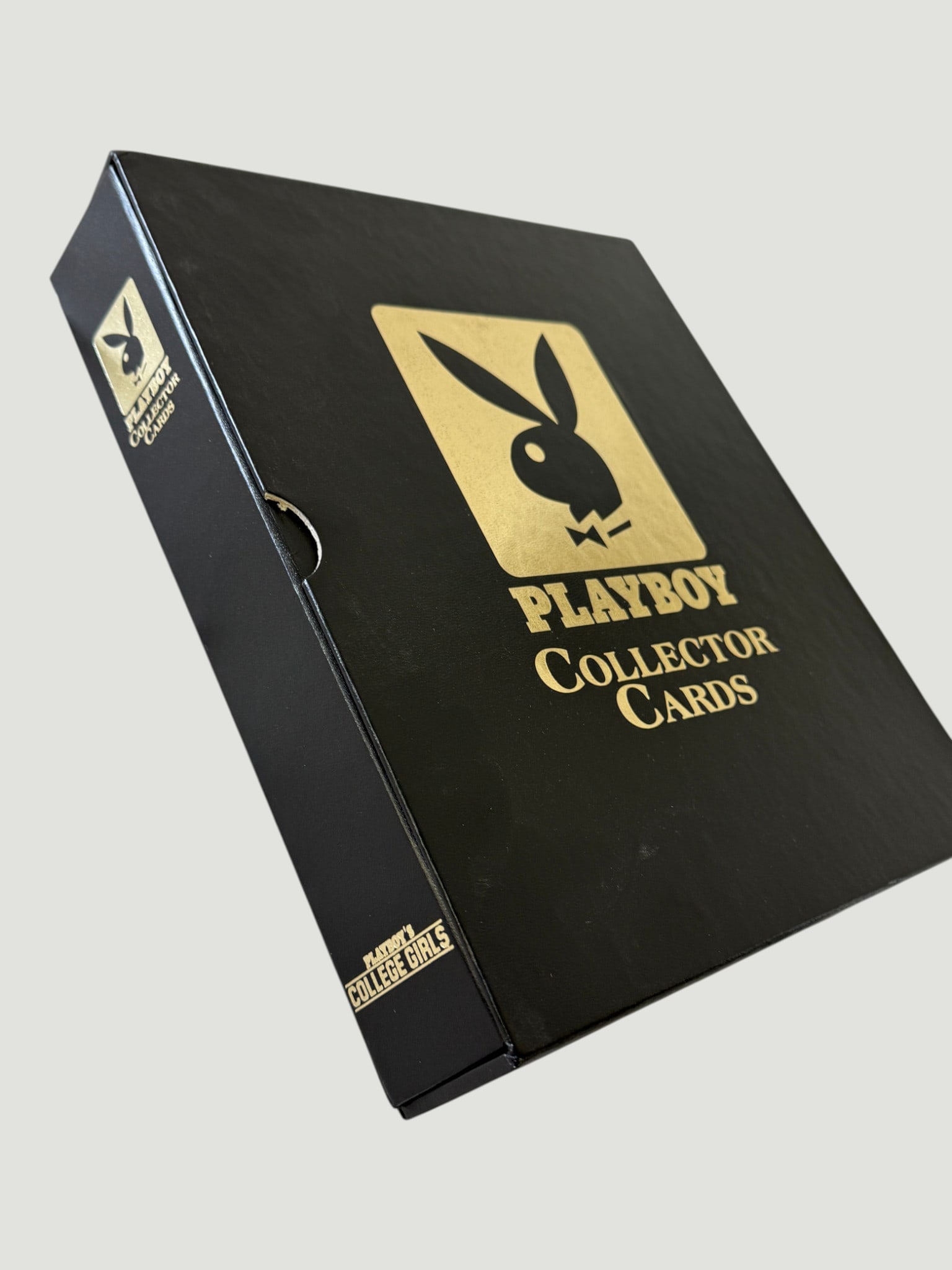 Playboy Collector Cards College Girls Complete Box Set Trading Cards: A Playboy Collector Cards 'College Girls' complete box set, presented in a premium black and gold foil-stamped hardcover clamshell-style box featuring the iconic Playboy Bunny logo. This is part of th