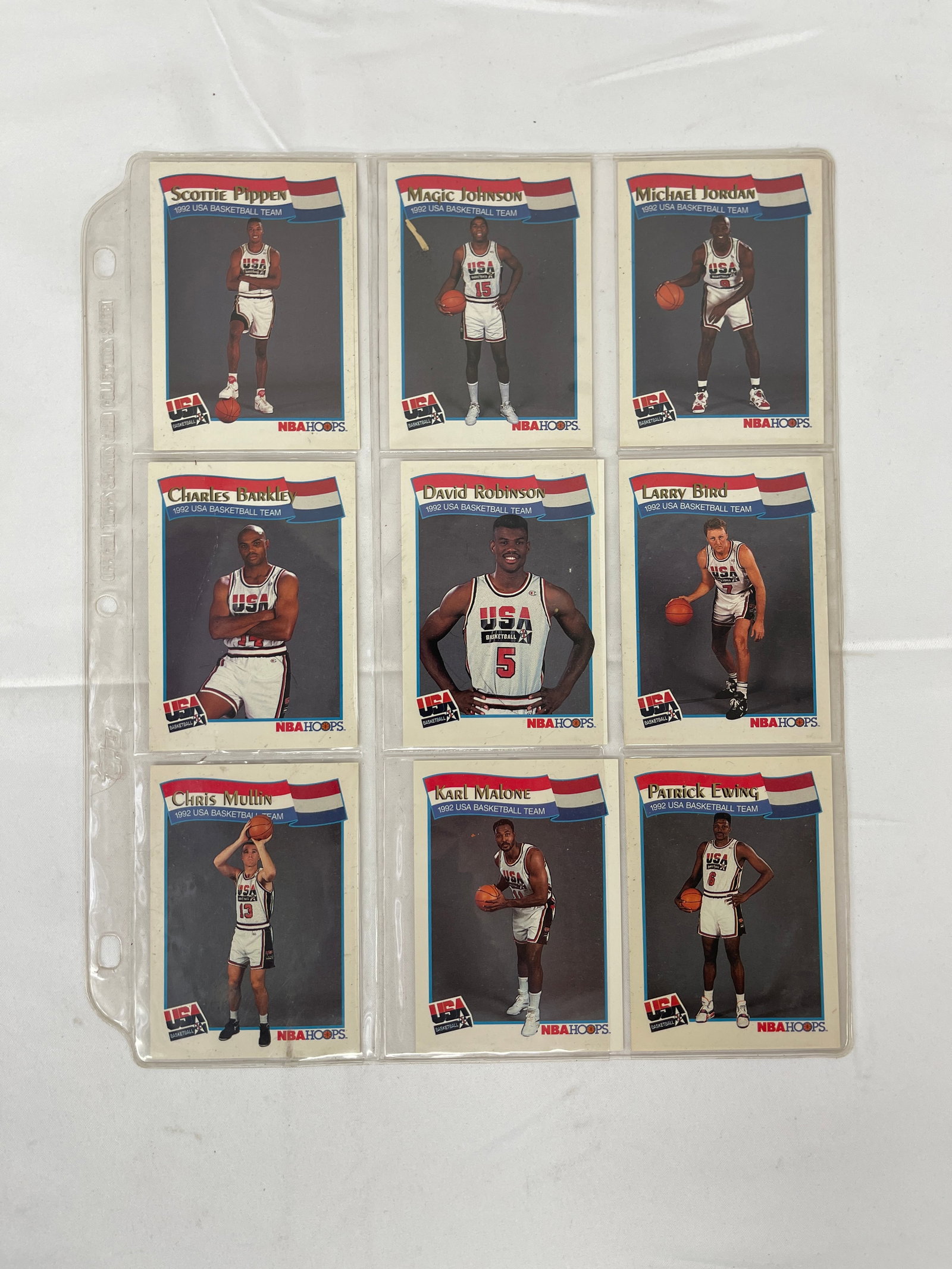 1991-92 NBA Hoops USA Dream Team Basketball Cards Set of 9 — Michael Jordan +: A complete 9-card set of 1991-92 NBA Hoops USA Basketball Team trading cards featuring members of the legendary 1992 Olympic 'Dream Team,' stored in a plastic binder page. The set includes Michael Jor