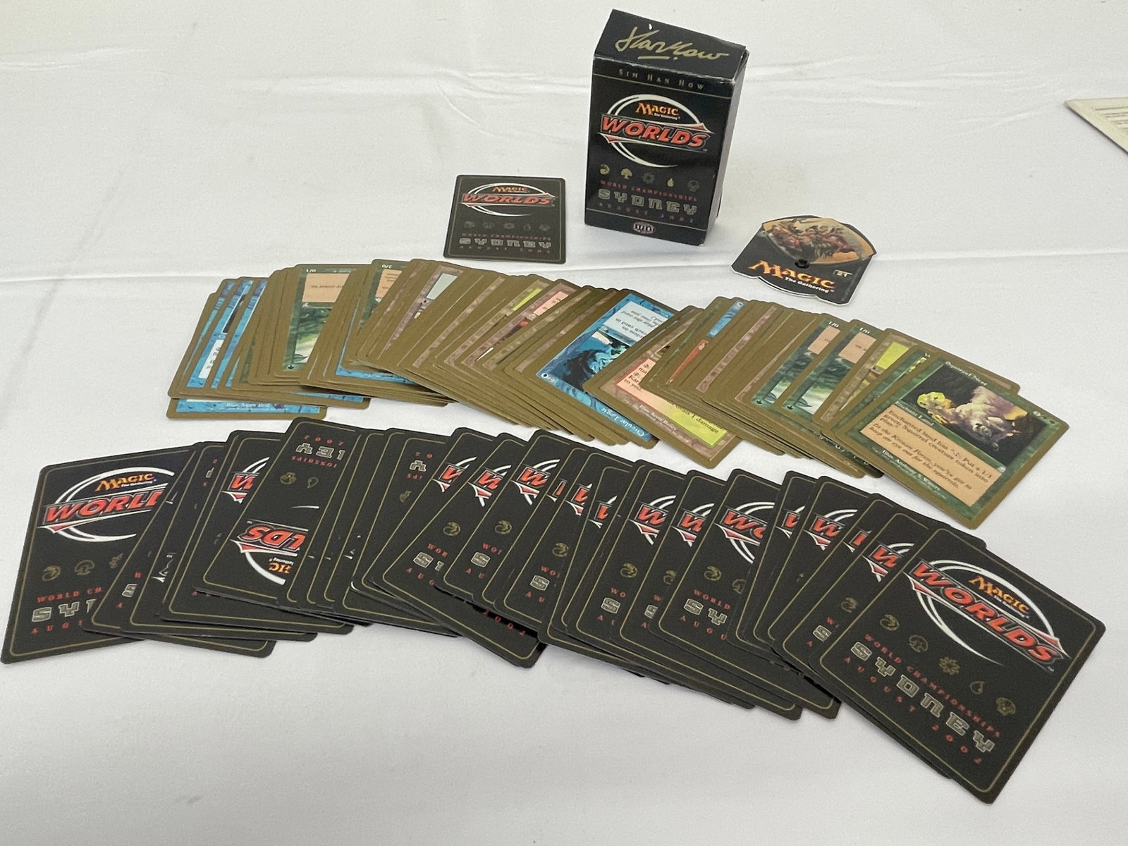 Magic: The Gathering 2002 World Championships Sydney Sin Han How Deck Set: This lot comprises the Magic: The Gathering 2002 World Championships Sydney deck set attributed to competitor Sin Han How, featuring the distinctive black-backed World Championships card backs printed