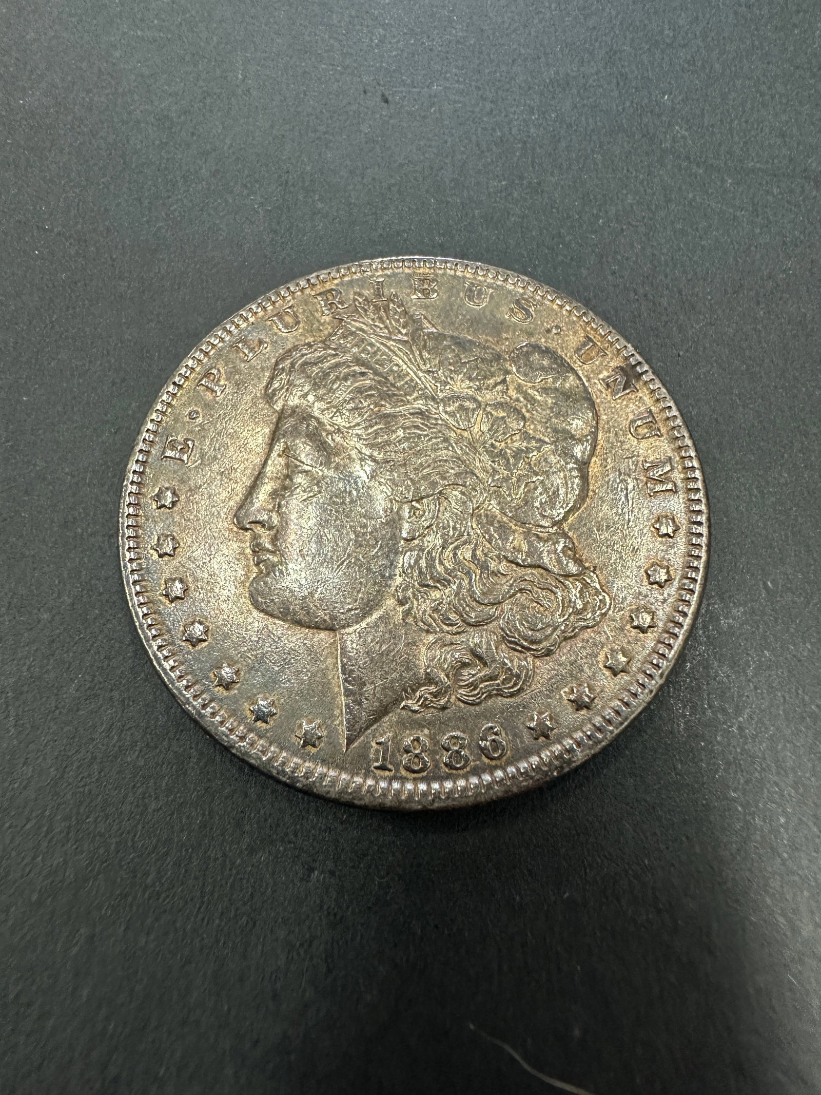MORGAN SILVER DOLLAR COIN 1886 (1 of 2)