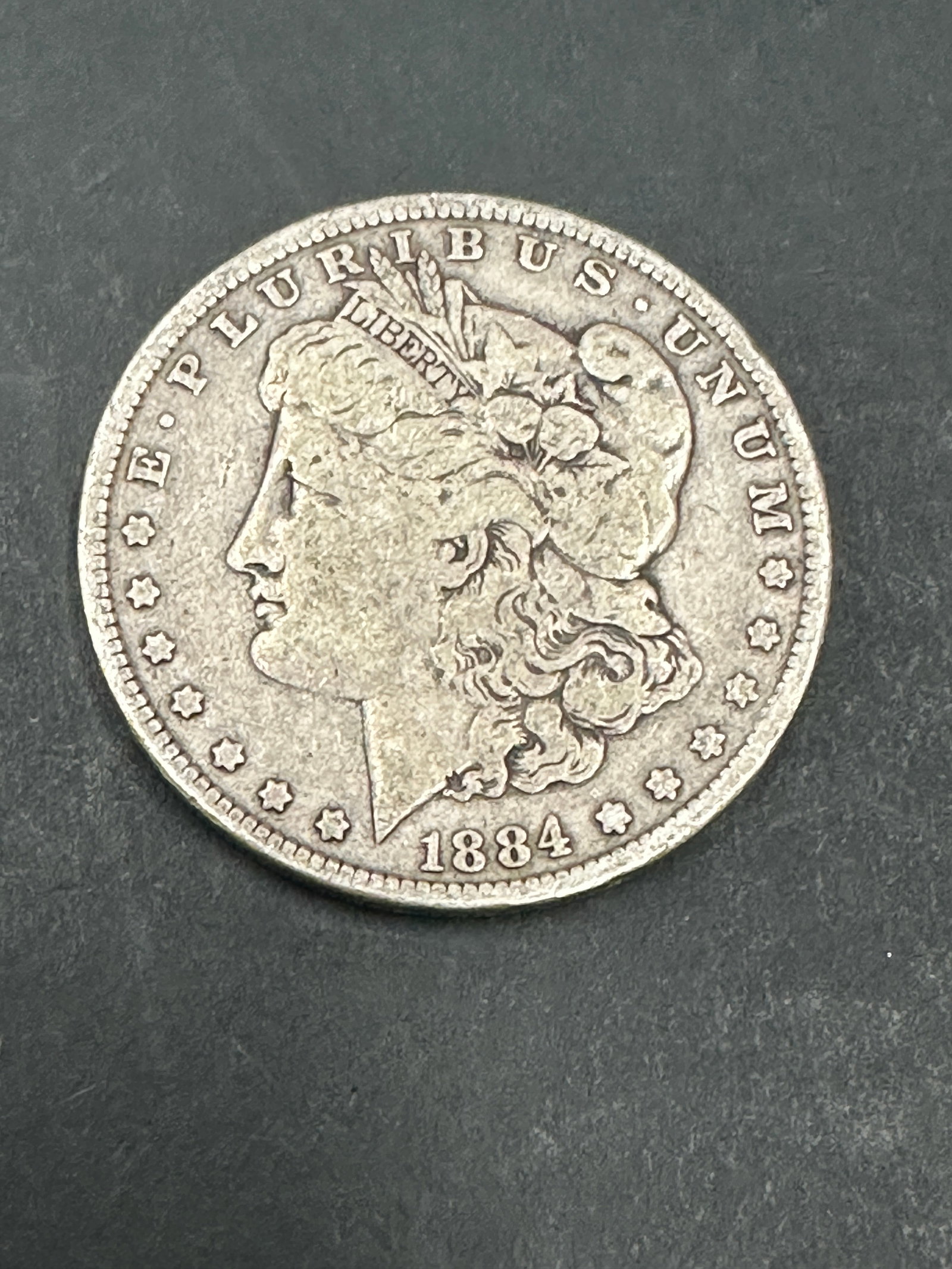 MORGAN SILVER DOLLAR 1884 COIN (1 of 2)