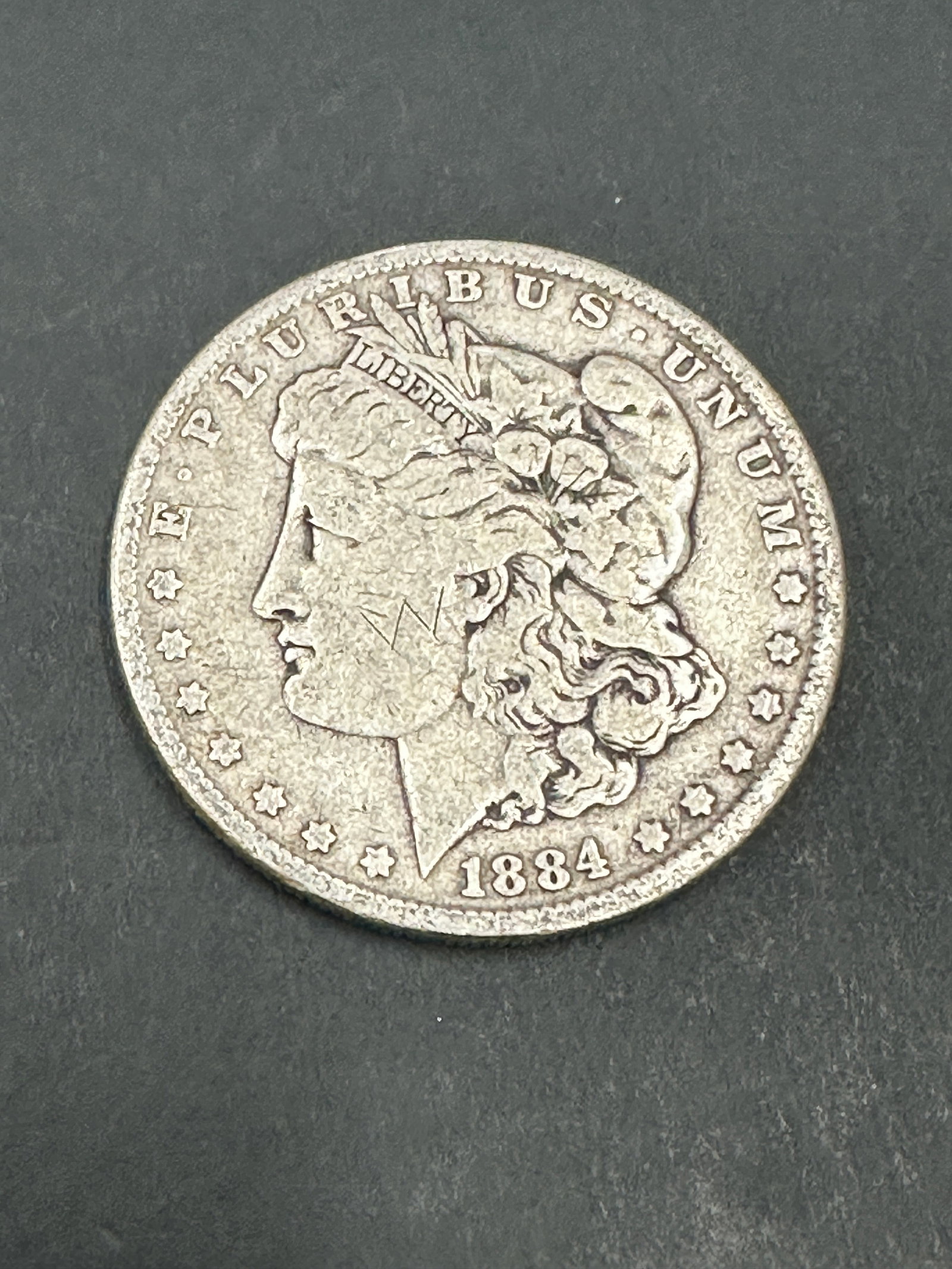 MORGAN SILVER DOLLAR 1884 COIN (1 of 2)