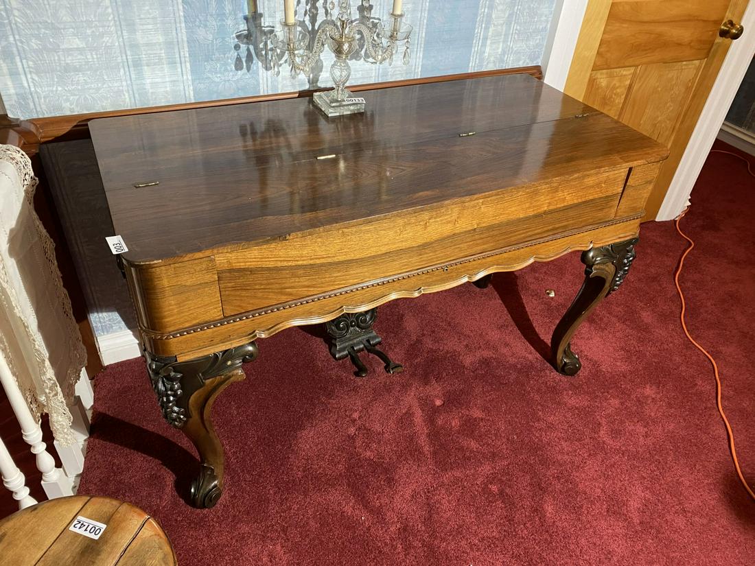 Unusual antique finely carved pump organ or piano: Foot pump operated. Not currently functional. Beautiful piece. Shipping not available. You must pick up on the pickup day(s) or forfeit your purchase. Thank you!