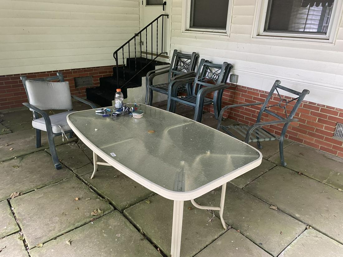 Vintage patio set: Nice metal chairs, plus table and old commercial ashtray. Includes cushions. Shipping not available. You must pick up on the pickup day(s) or forfeit your purchase. Thank you!