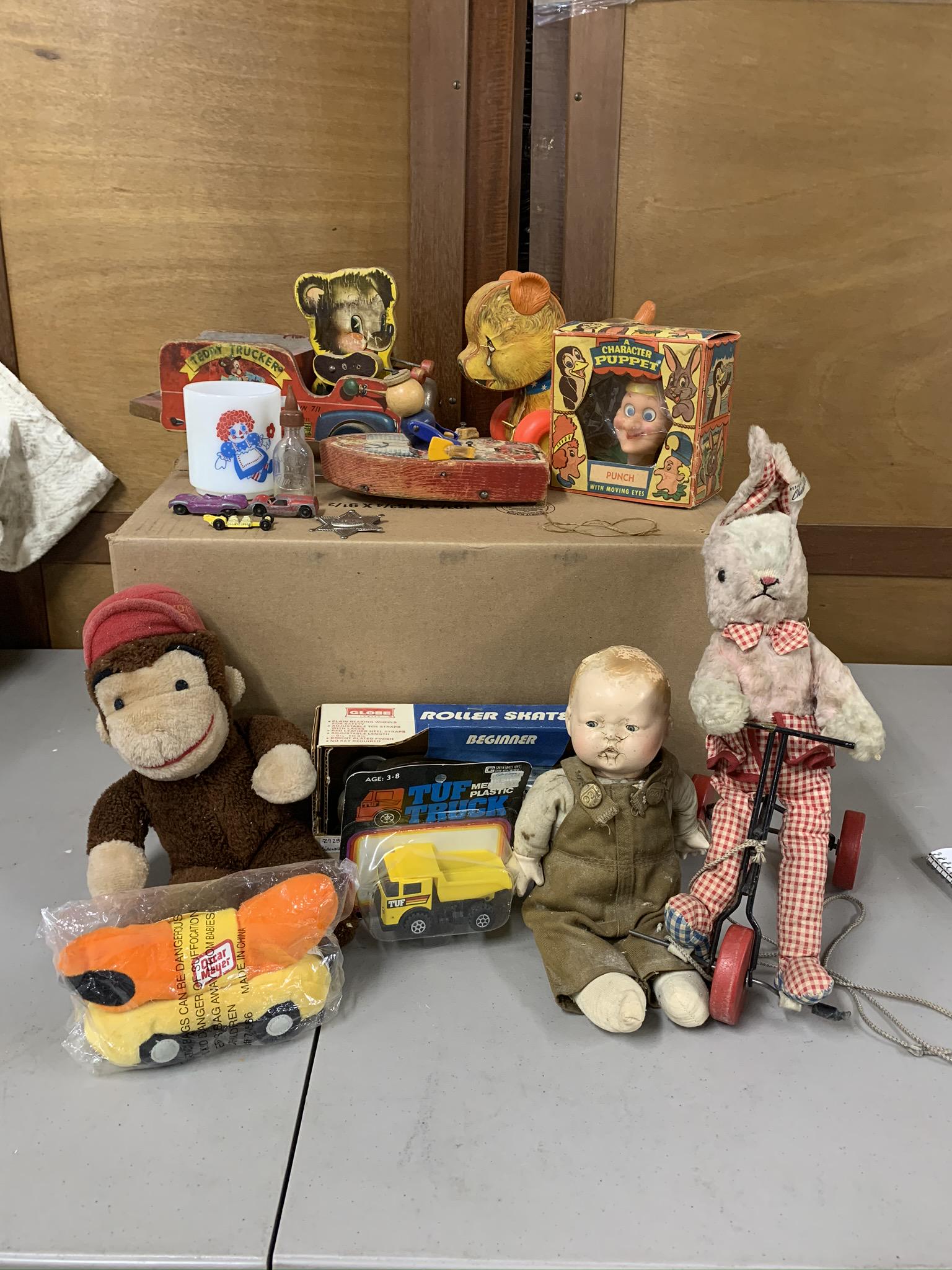 Assortment of Vintage Toys: Fisher Price teddy truck cry baby bear boat pull toy, Peter puppet Play Thing Inc punch puppet, Curious George doll, bunny on tricycle, Globe roller skates and more Shipping not available you must pic