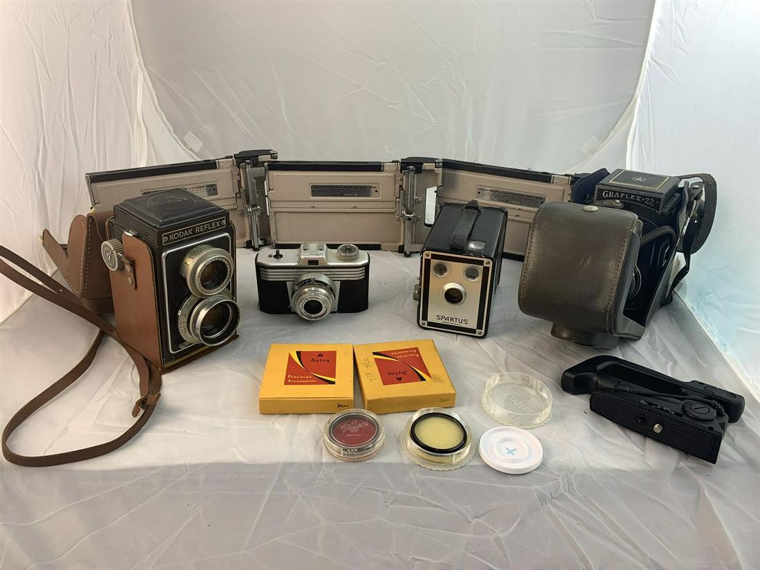 4 Vintage Cameras Plus 3 Film Holders by Polaroid Model: Kodak Reflex, Spartus Iloca Quick-A, Graflex 22 and More. Free pickup or well drop off at shipper for $3 delivery fee.