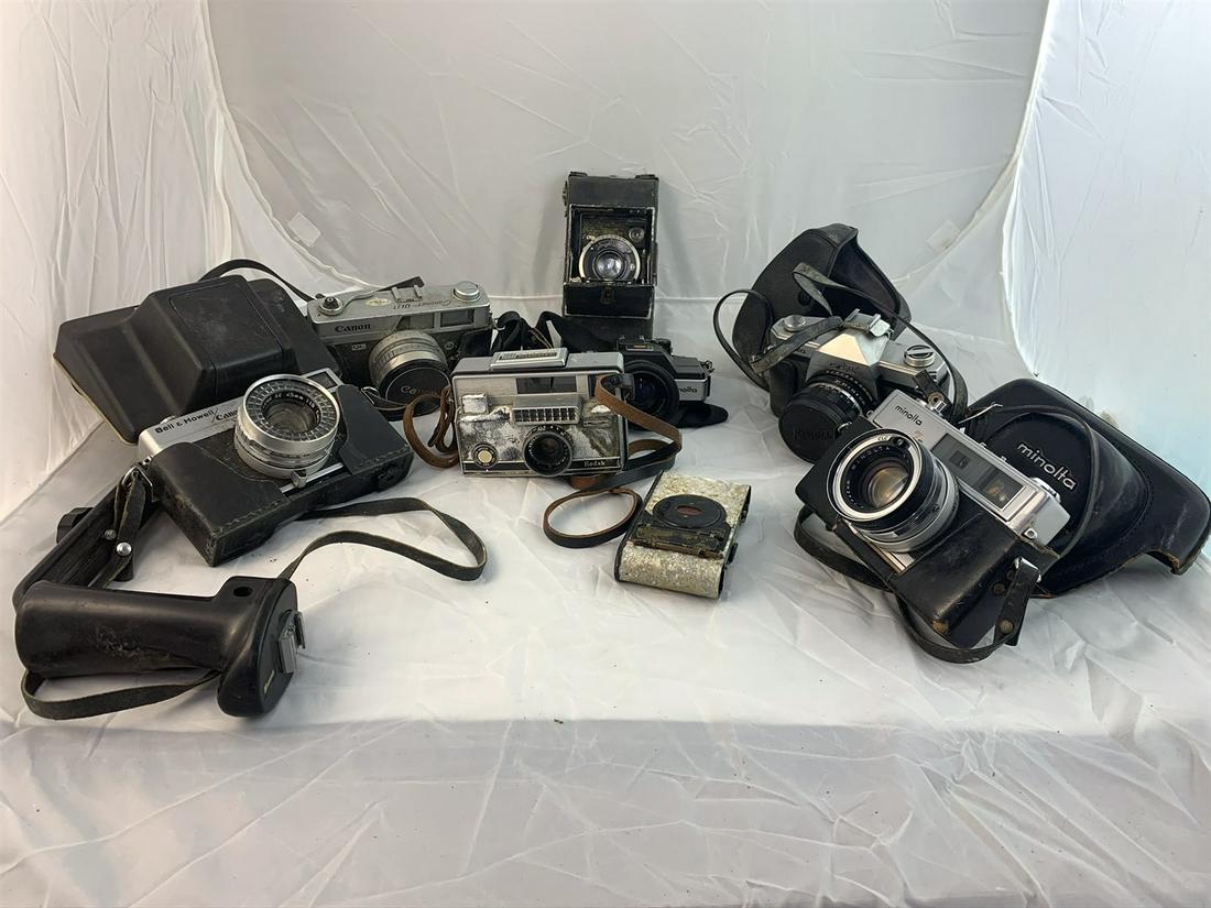 7 Vintage Cameras Including Folding Cameras: Minolta 110Zoom SLR, Canon Canonet QL17, Minolta HI-Match 7s, Bell and Howell/Canon, Voigtlander Compur, Kowa SET, Kodak Instamatic 800 with box, plus more. Free pickup or well drop off at shipper for