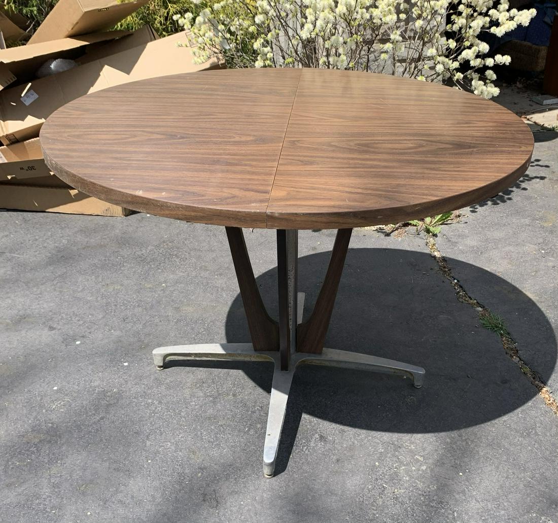 Mid-century Modern Table by Chromcraft: 42 inch Diameter x 30 inches High. Our shipping is not available on this item. You may send a shipper to pickup, or you or your representative must pickup at the home on Sunday May 2 between 11 am and