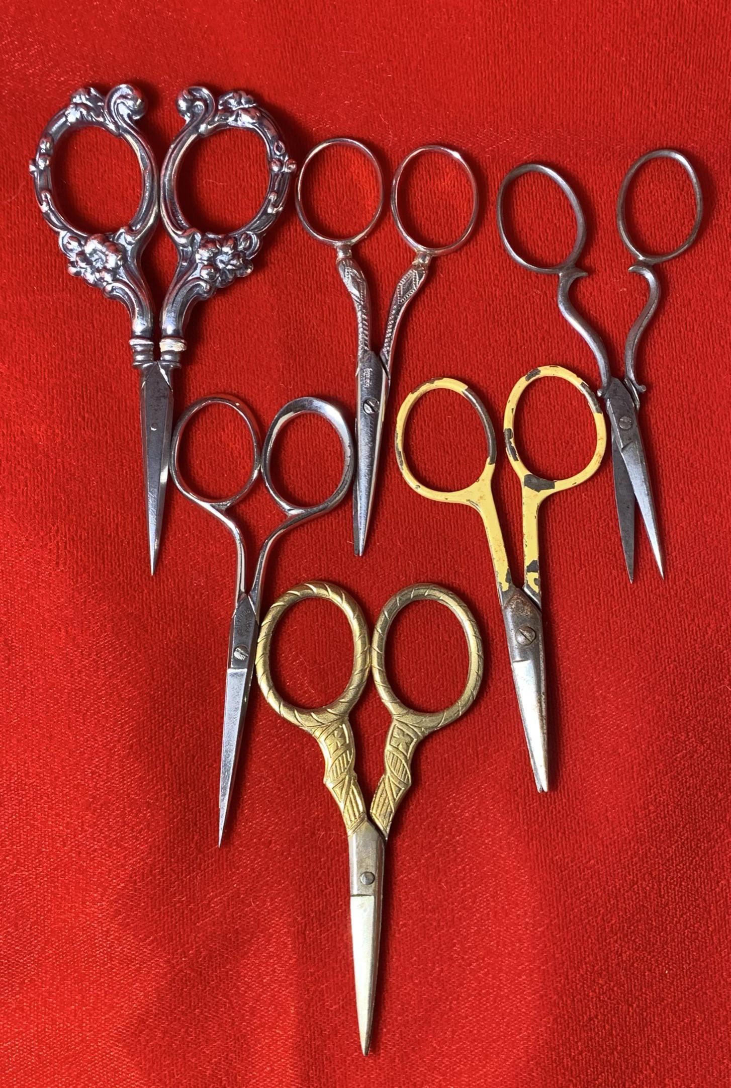 6 Pairs of Ornate Scissors. Some are Sterling. See: Free pickup or we will drop at the shipper for a $3 fee.