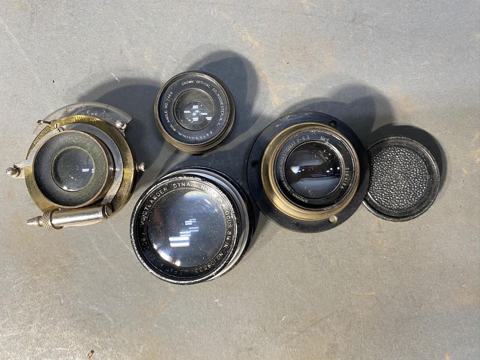 Group lot of antique camera lenses: Group lot of antique camera lenses. Bausch-Lomb; Kodak Anastigmat F-6.3; Crown Optical; Voigtlander; early brass lens. Free pickup or we'll drop at our shipper for a $3 drop off fee.