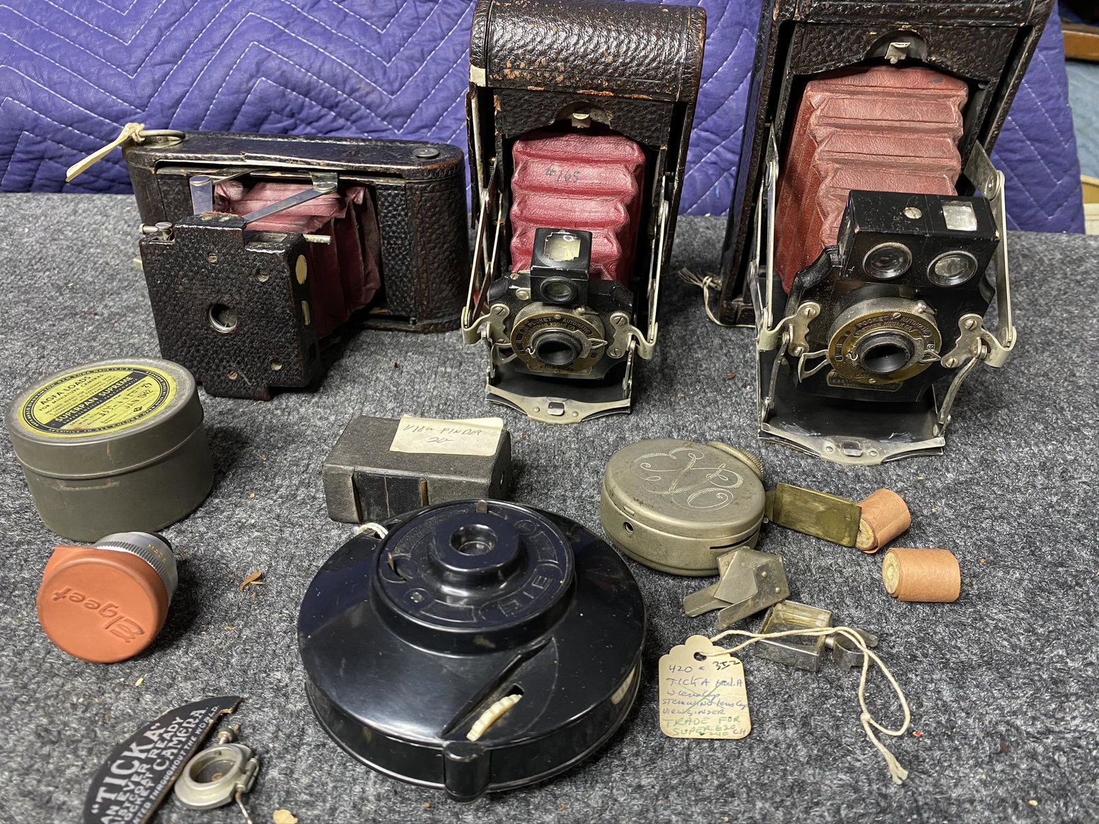 Group lot of folding cameras and accessories: Group lot of folding cameras and accessories. View finder, film tin, shutter, lens, Kodak folding cameras with red bellows. Free pickup or we'll drop at our shipper for a $3 drop off fee.