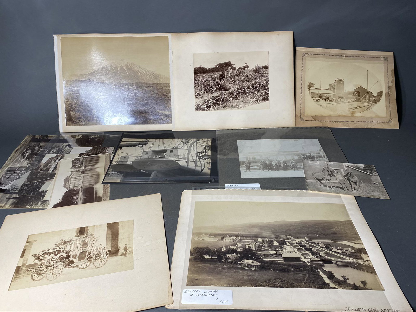 Group lot of 19th century photos including Railroad: Group lot of 19th century photos including Railroad. Utica, NY railroad related, foreign including what appears to be Tenerife, canal locks in Scotland, elaborate carriage, early New England ship ster