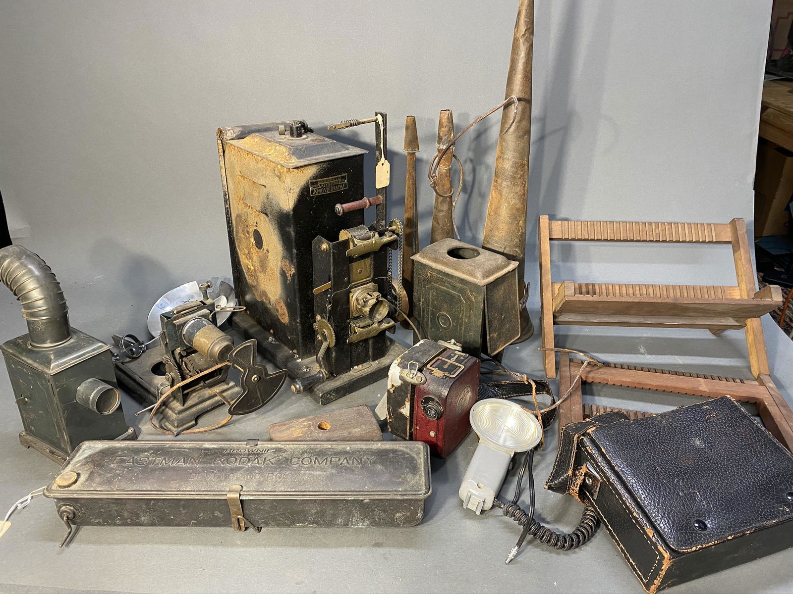 Group lot - Projectors, Magic Lantern, Movie camera etc: Group lot - Projectors, Magic Lantern, Movie camera etc. Brownie developing box, plate drying stands, battery operated movie light, parade horns. Free pickup or we'll drop at our shipper for a $3 drop