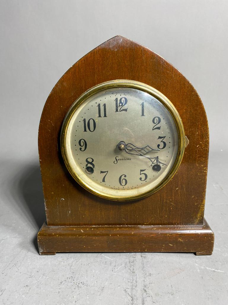 Antique Mantle Clock with Unusual Shape By Sessions: Antique Mantle Clock with Unusual Shape By Sessions. 10.5" high x 9" wide. In-house shipping available. Pickup is Friday, May 12th from 11am to 6pm and Saturday, May 13th from 9am to 3pm in Bloomingda