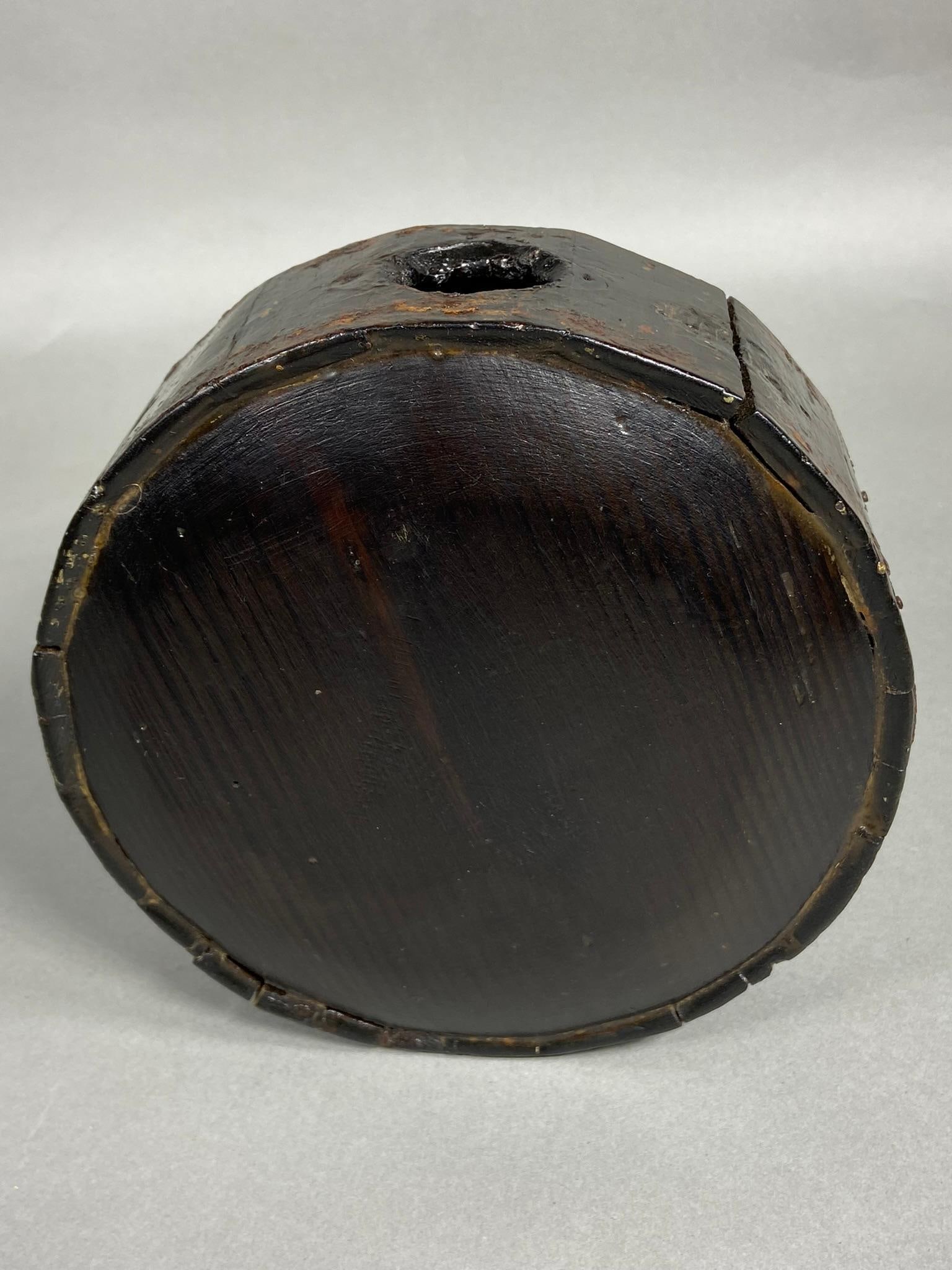 19TH CENTURY WOODEN DRUM CANTEEN: Early to Mid 19th century wood - wooden drum canteen. Measures 7" in diameter x 2 & 3/4". Spout and metal bands are missing. In-house shipping is available. Pickup is Thursday, Oct. 19 and Friday Oct.
