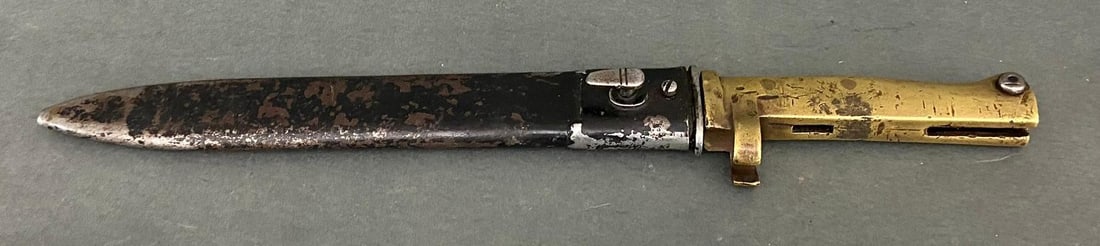 WWI IMPERIAL GERMAN BRASS HANDLED ERSATZ BAYONET: WWI - Imperial era German brass handled bayonet. The blade is 9 1/2" and the grip is 5 1/8". Total length is 14 5/8". Stamped at the base of the spine is a 5&1/8". total length is 14&5/8". Stamped at 