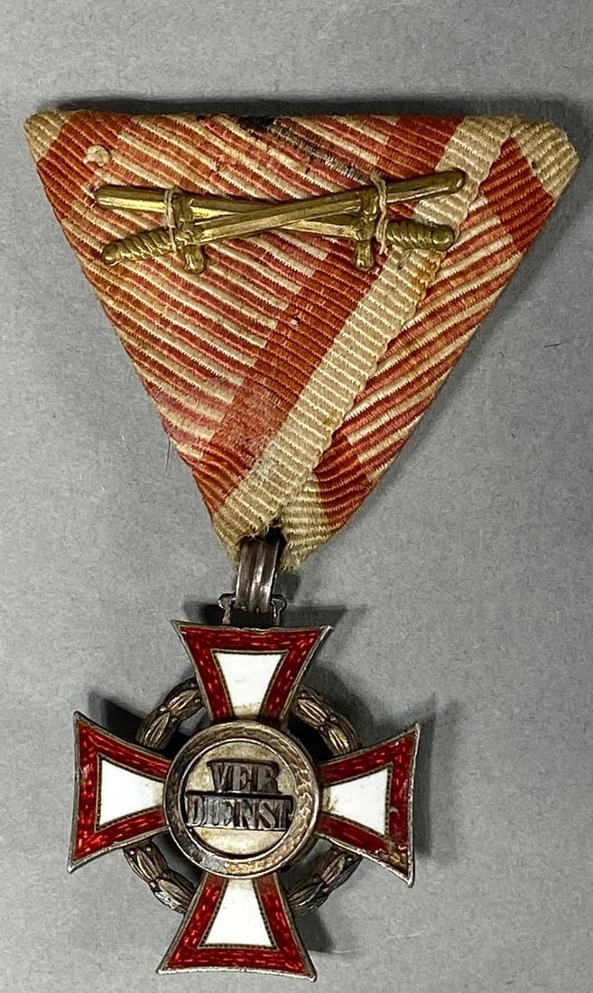 WWI AUSTRIA - HUNGARY MILITARY MERIT CROSS: World War One Austro-Hungarian 3rd class Military Merit Cross. Crossed swords are affixed to the ribbon. Effective December 13, 1916 The swords were authorized for awards for bravery. The original rib