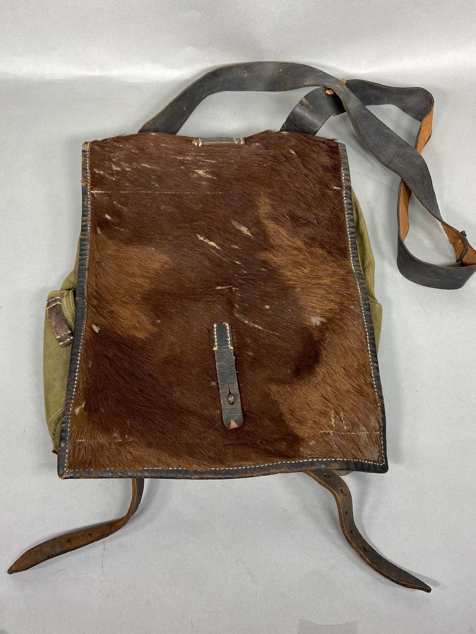 WWII NAZI GERMAN PONY FUR PACK IDED & UNIT MARKS: World War Two German pony fur backpack with back straps modified/replaced in order to wear on the side and over one shoulder.Ided and regiment - division marked - 13.R.47 Manufacturer info stamped. Eh